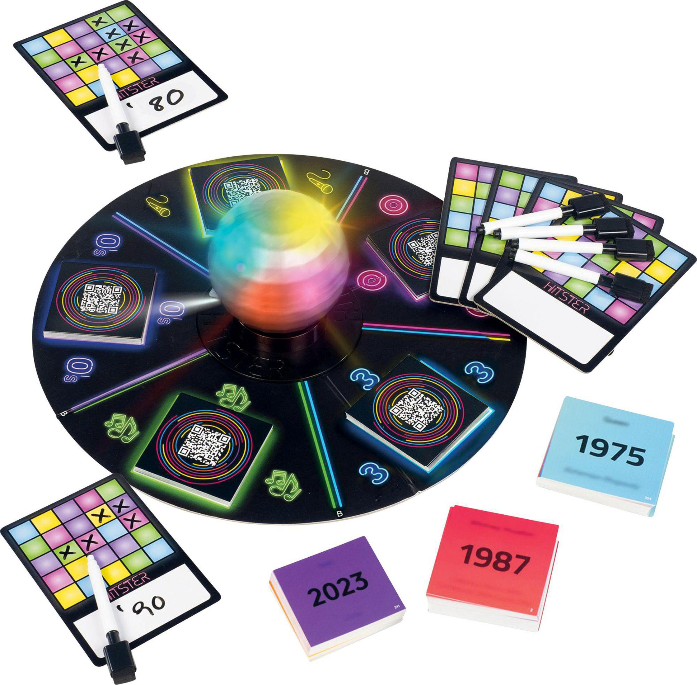 Gioco da tavolo con carte e una trottola. Include una palla colorata e diverse carte colorate.