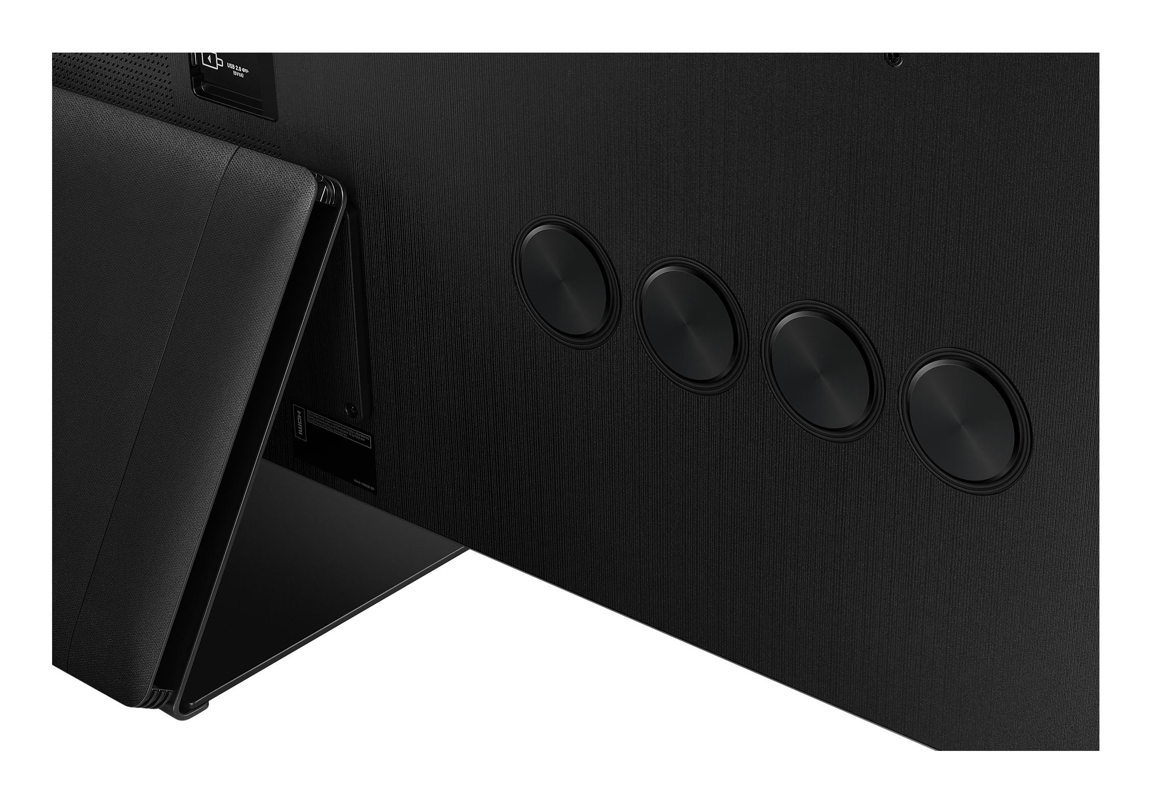 Primo piano del retro di una TV nera con elementi di design e porte.