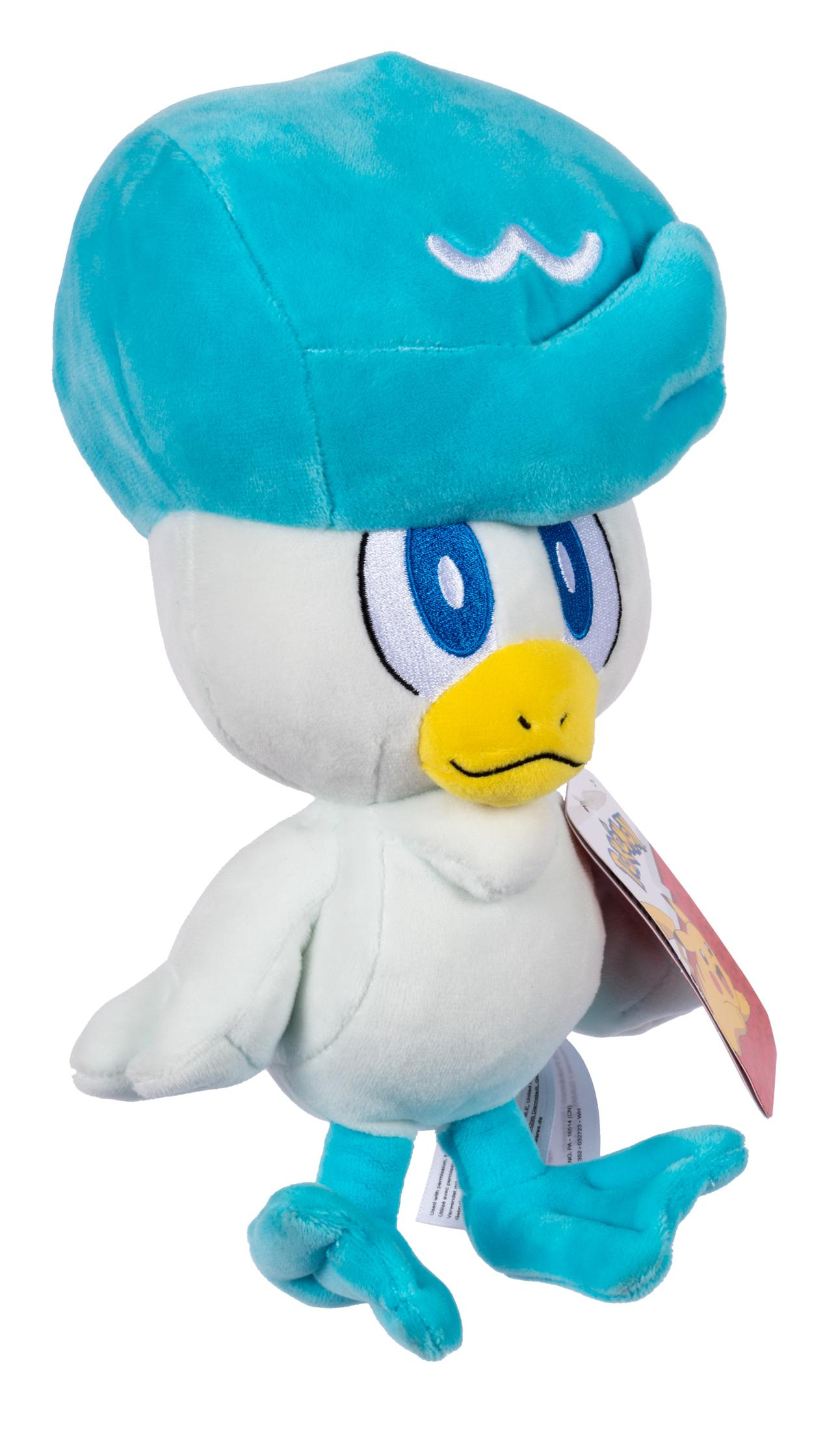 Peluche blanco y azul, Quaxly de Pokemon, con gorro azul y etiqueta.