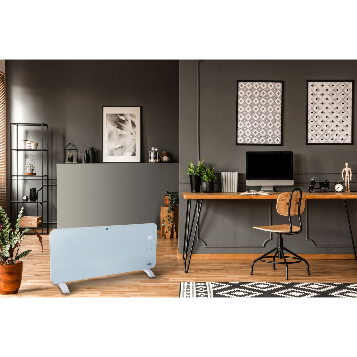 Een kamer met een kachel, bureau, stoel, kunstwerken en planten. Het kleurenschema is grijs en hout.
