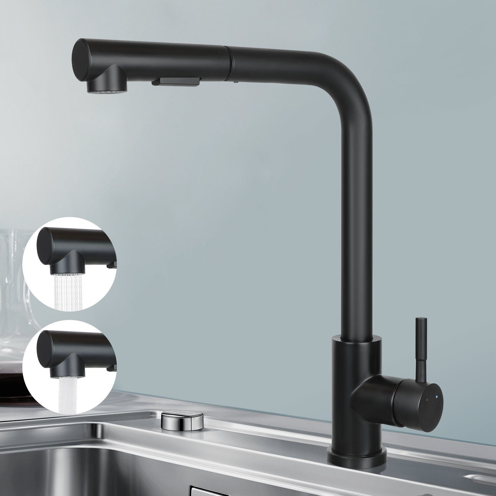 Schwarze Küchenarmatur mit ausziehbarem Sprühkopf. Modernes Design. Auf silberner Spüle.