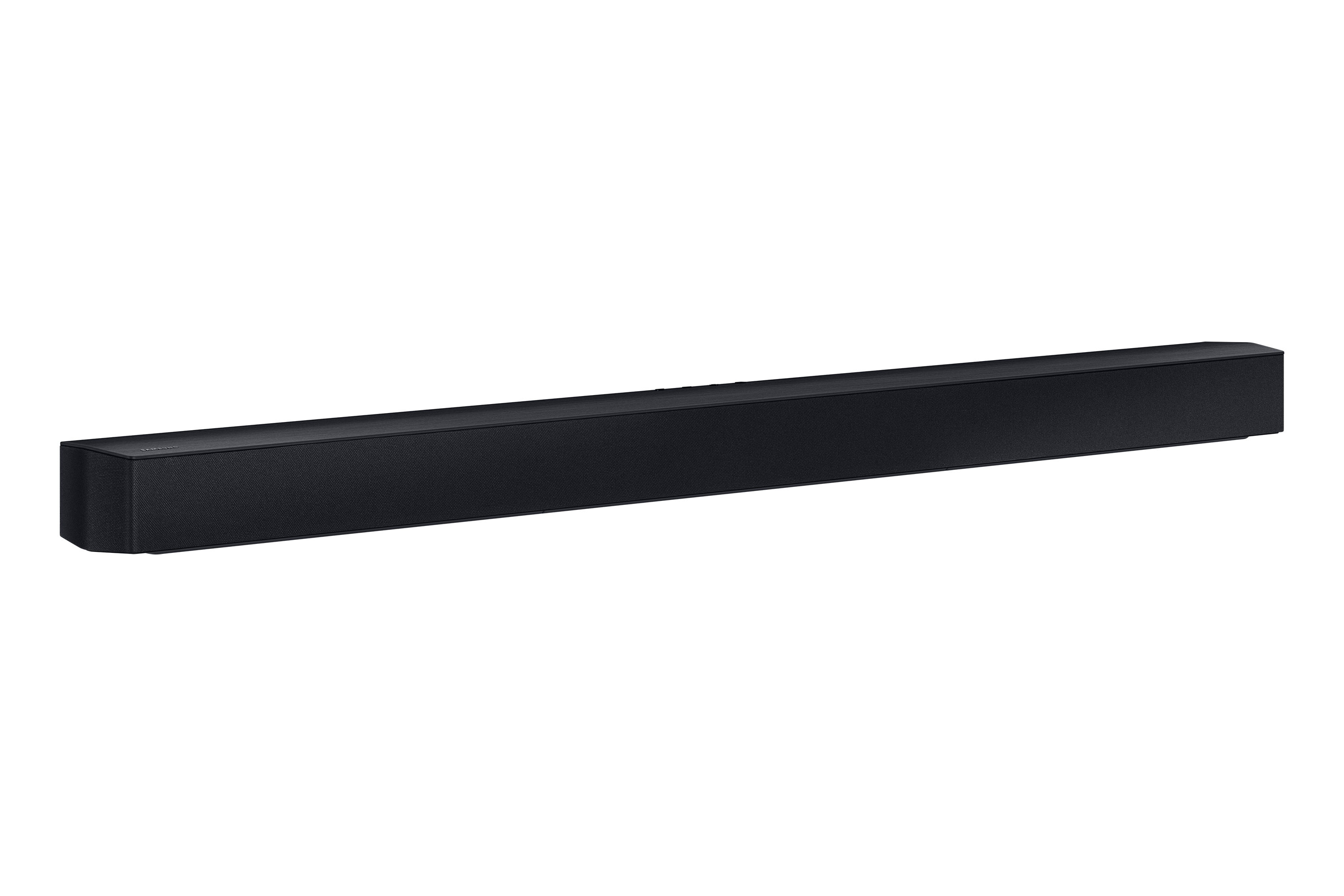 Una soundbar lunga e nera. Ha una forma rettangolare e poggia su una superficie bianca.