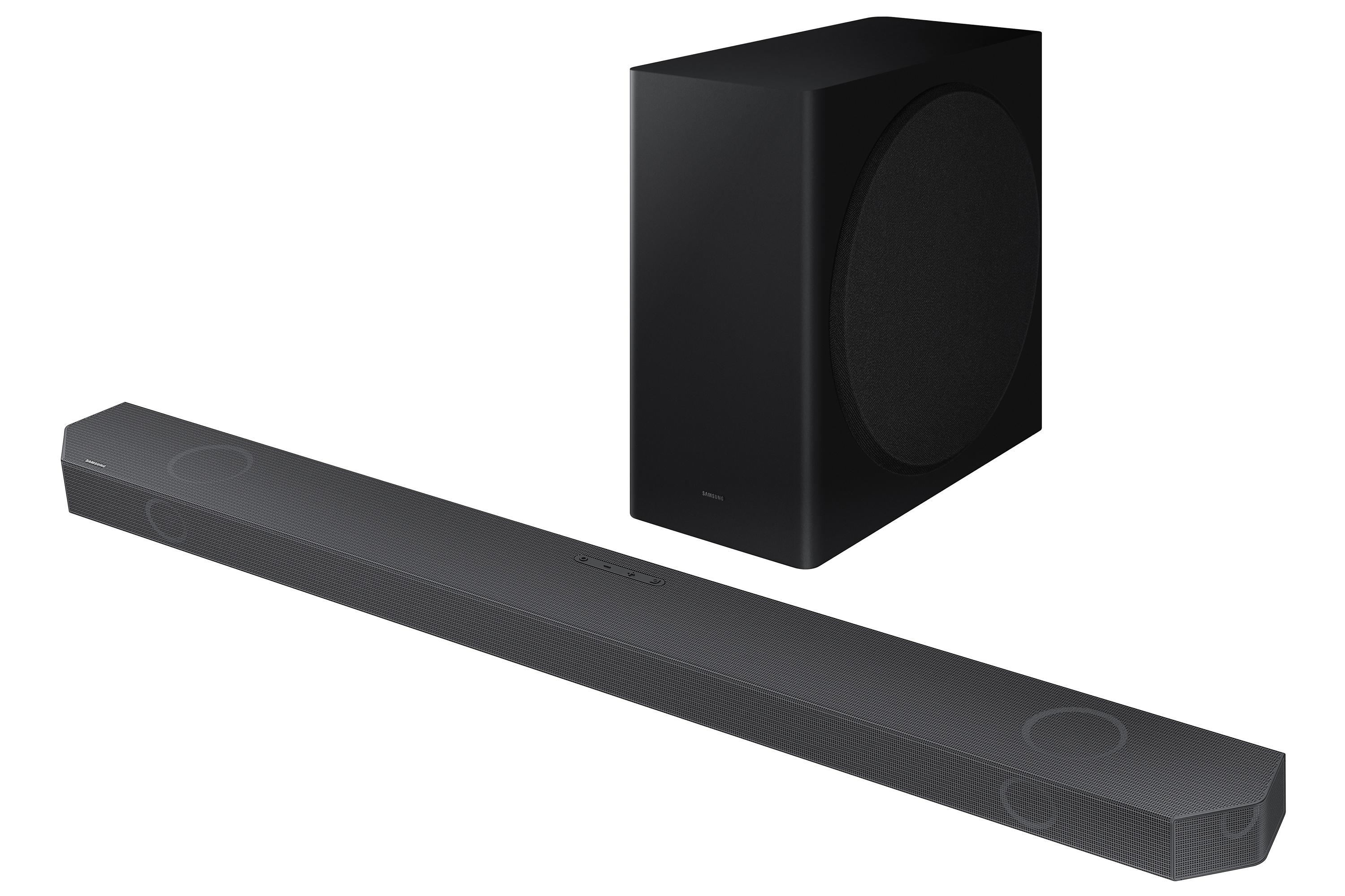 Czarny soundbar z pasującym subwooferem. Soundbar ma rząd przycisków na górze. Białe tło.
