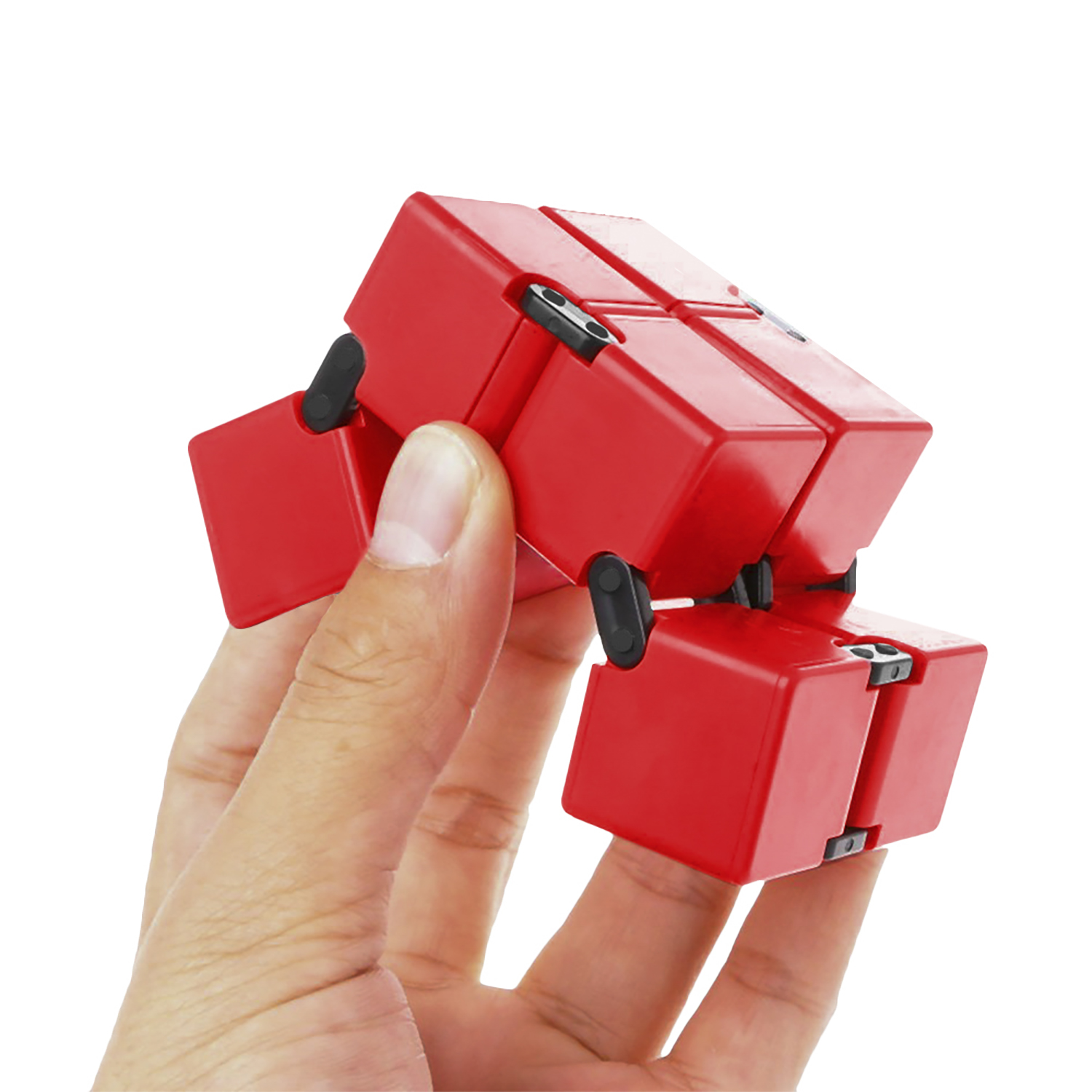 Juguete cubo infinito rojo. Sostenido por una mano, mostrando el cubo en varias posiciones.