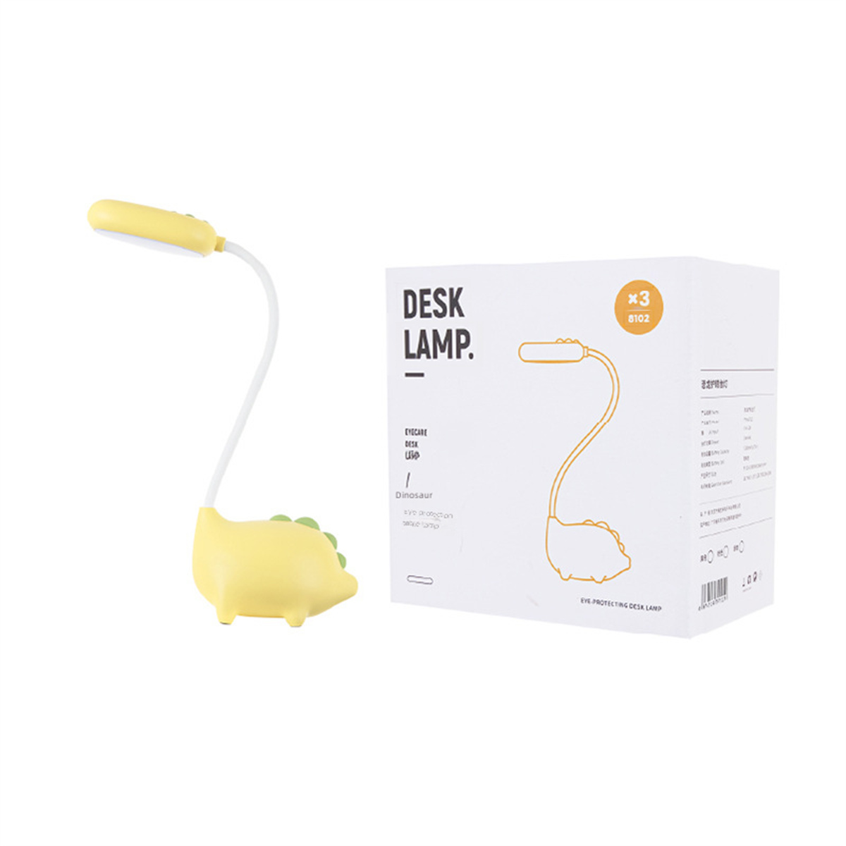 Gelbe Dinosaurier-Schreibtischlampe mit passender Box. Auf der Box steht 'DESK LAMP'.