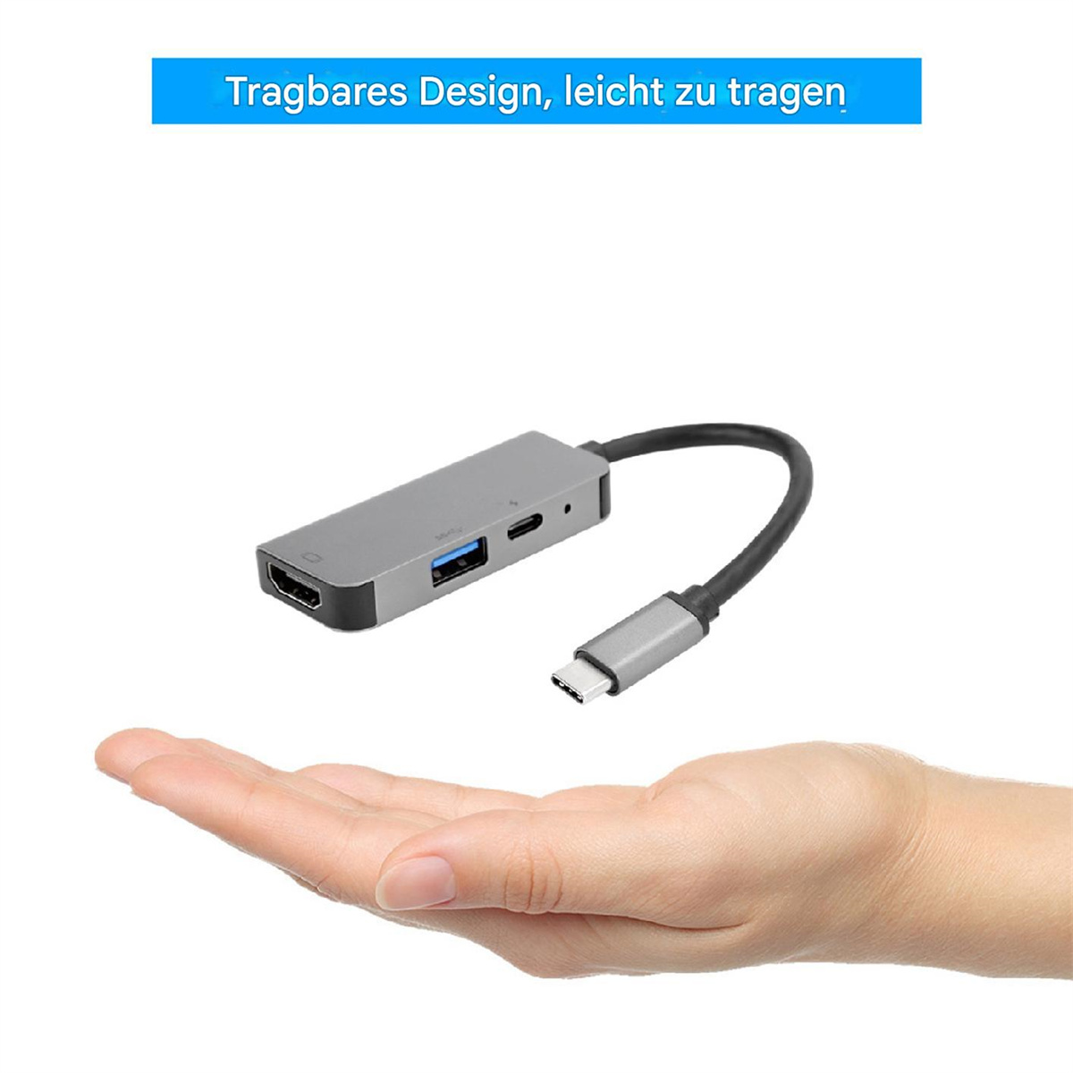 Ein grauer USB-Hub mit mehreren Anschlüssen wird von einer Person in der Hand gehalten.