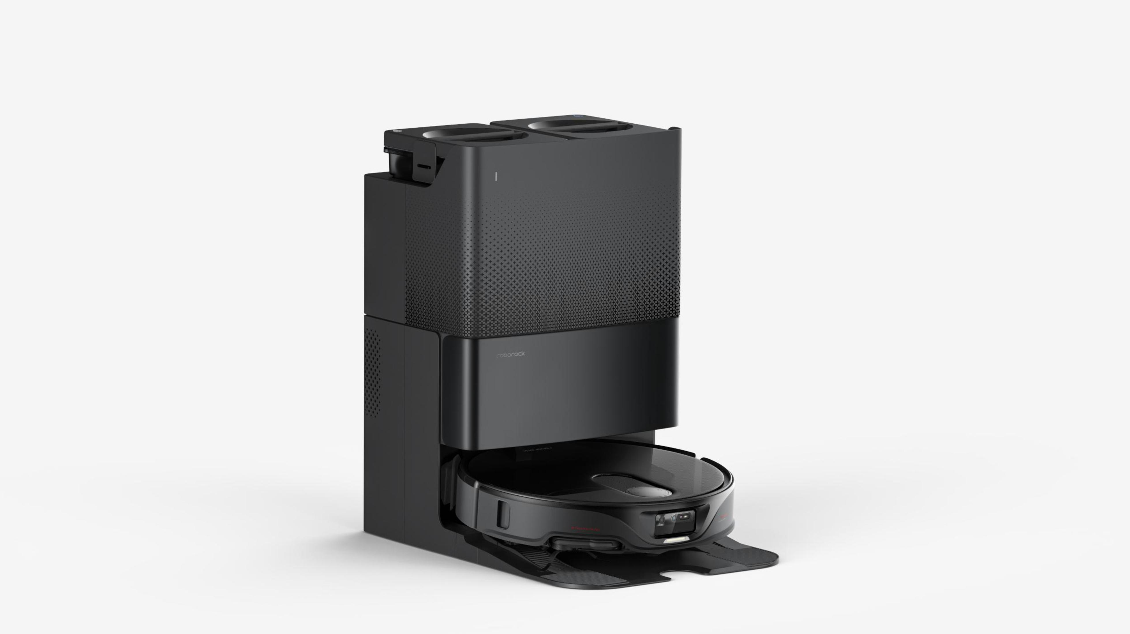 Czarny odkurzacz z podstawą i stacją dokującą na białym tle.