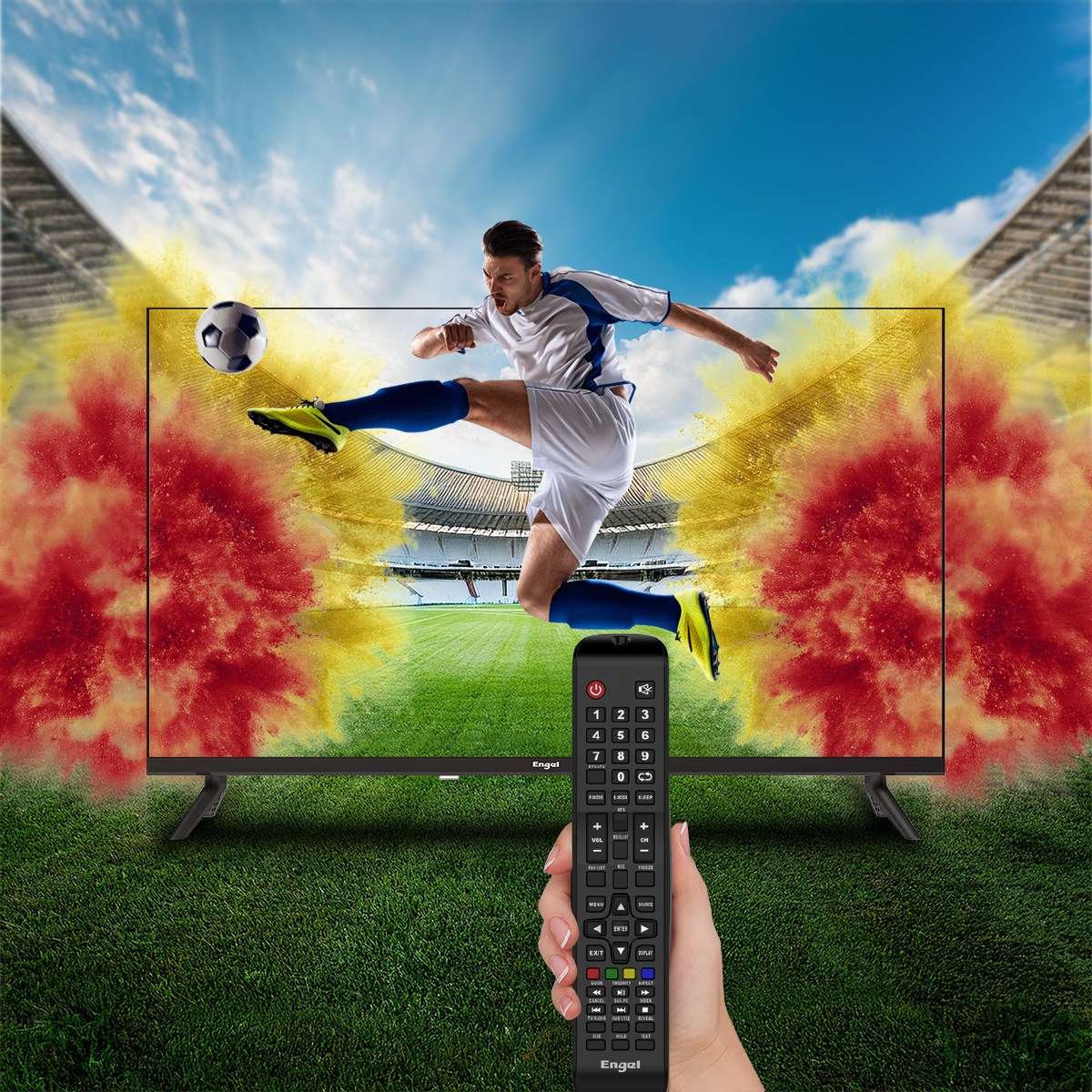 Scena piłkarska na TV, gracz kopiący piłkę, pilot trzymany poniżej.