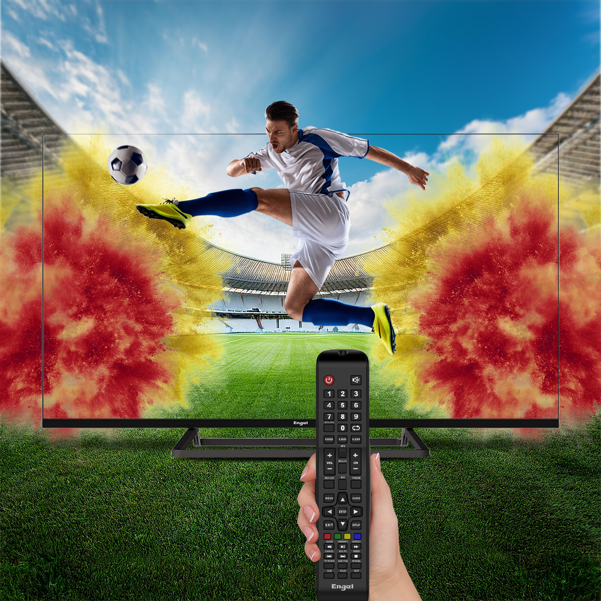 Un hombre saltando frente a un televisor que muestra un partido de fútbol, sosteniendo un control remoto. Cielo y hierba al fondo.