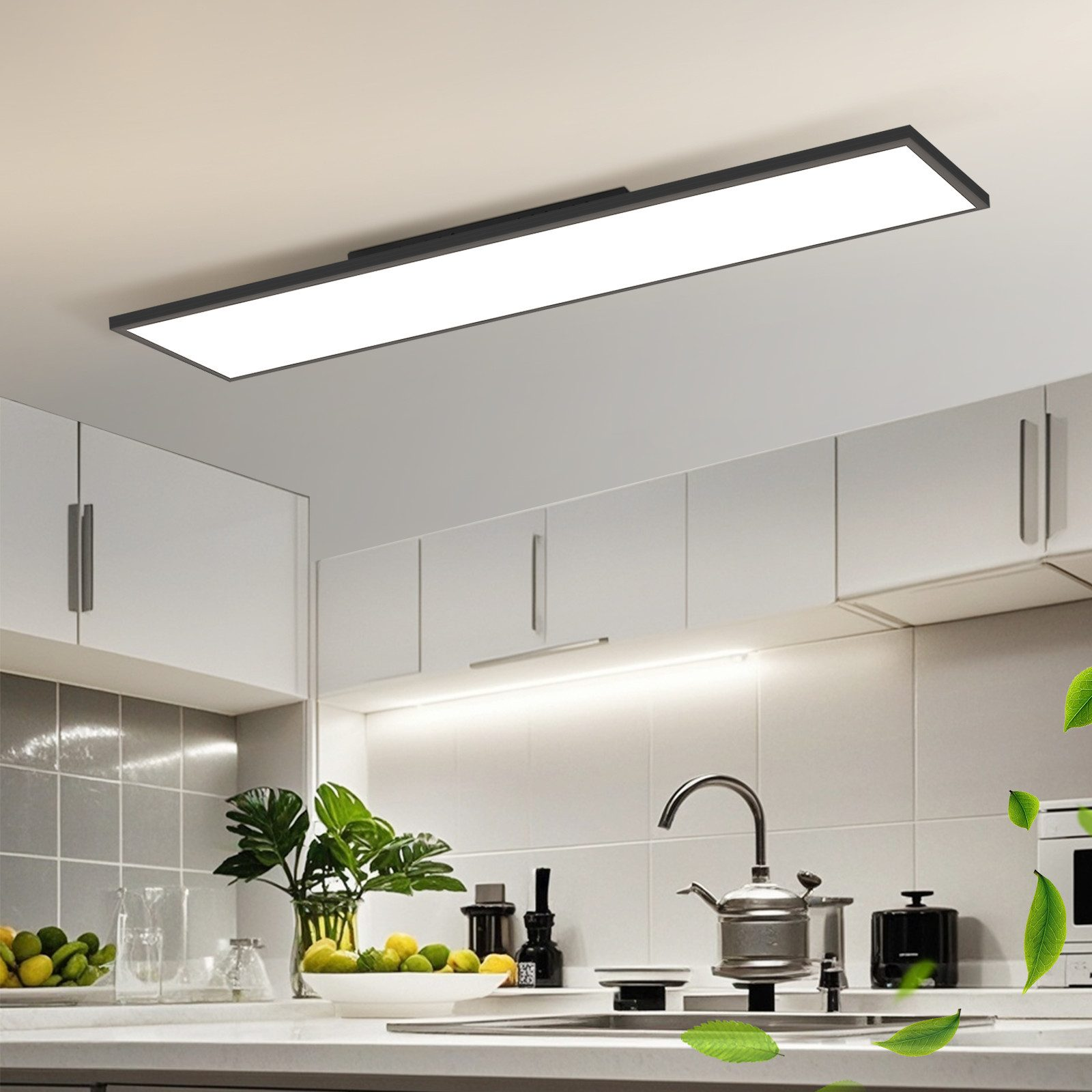 Una cucina con mobili bianchi e una lunga lampada da soffitto rettangolare.
