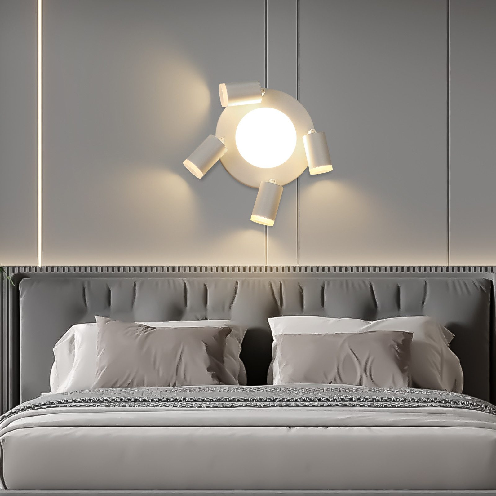Parete della camera da letto con un moderno apparecchio di illuminazione sopra il letto, con faretti multipli.