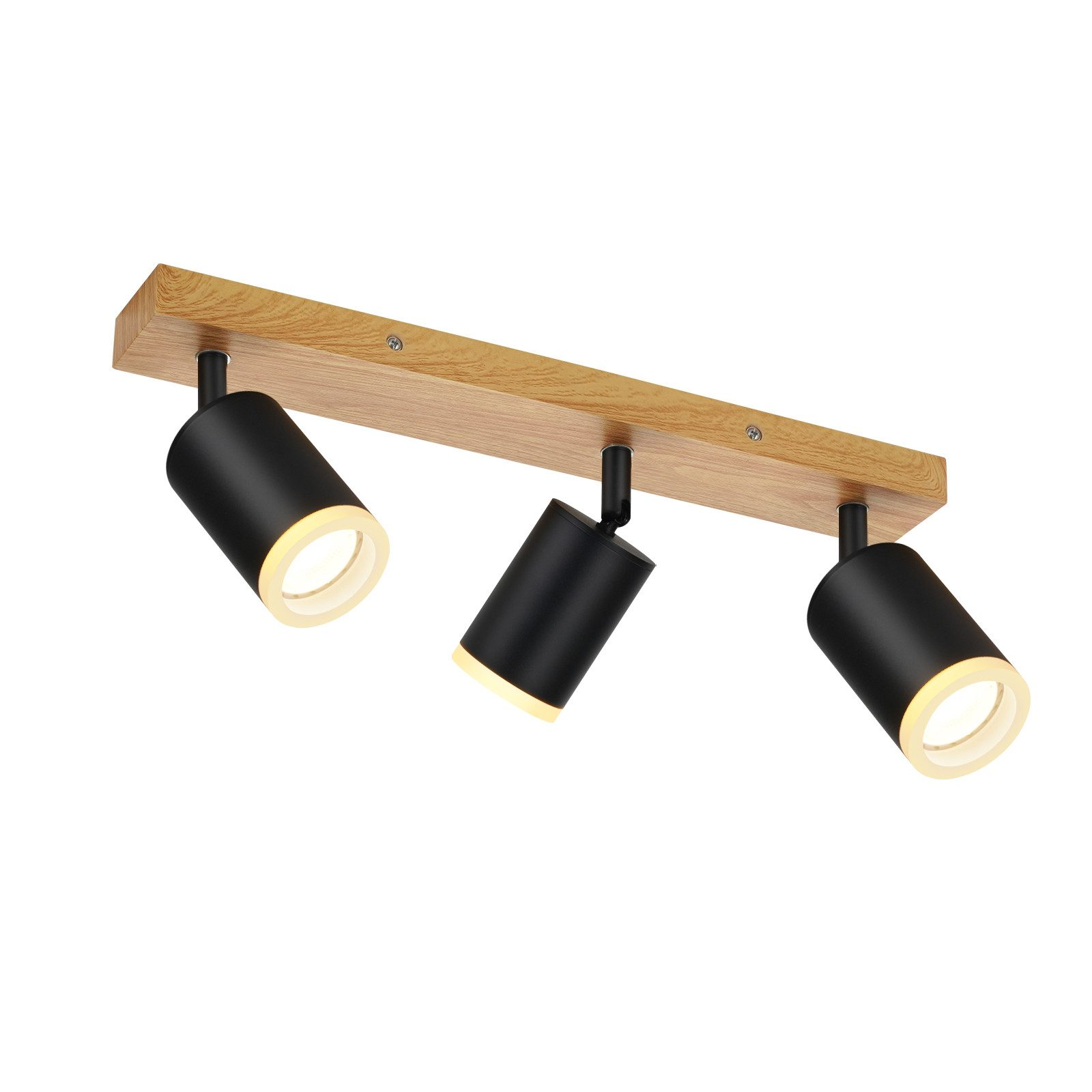 Tavola di legno con tre faretti neri. Sfondo bianco.