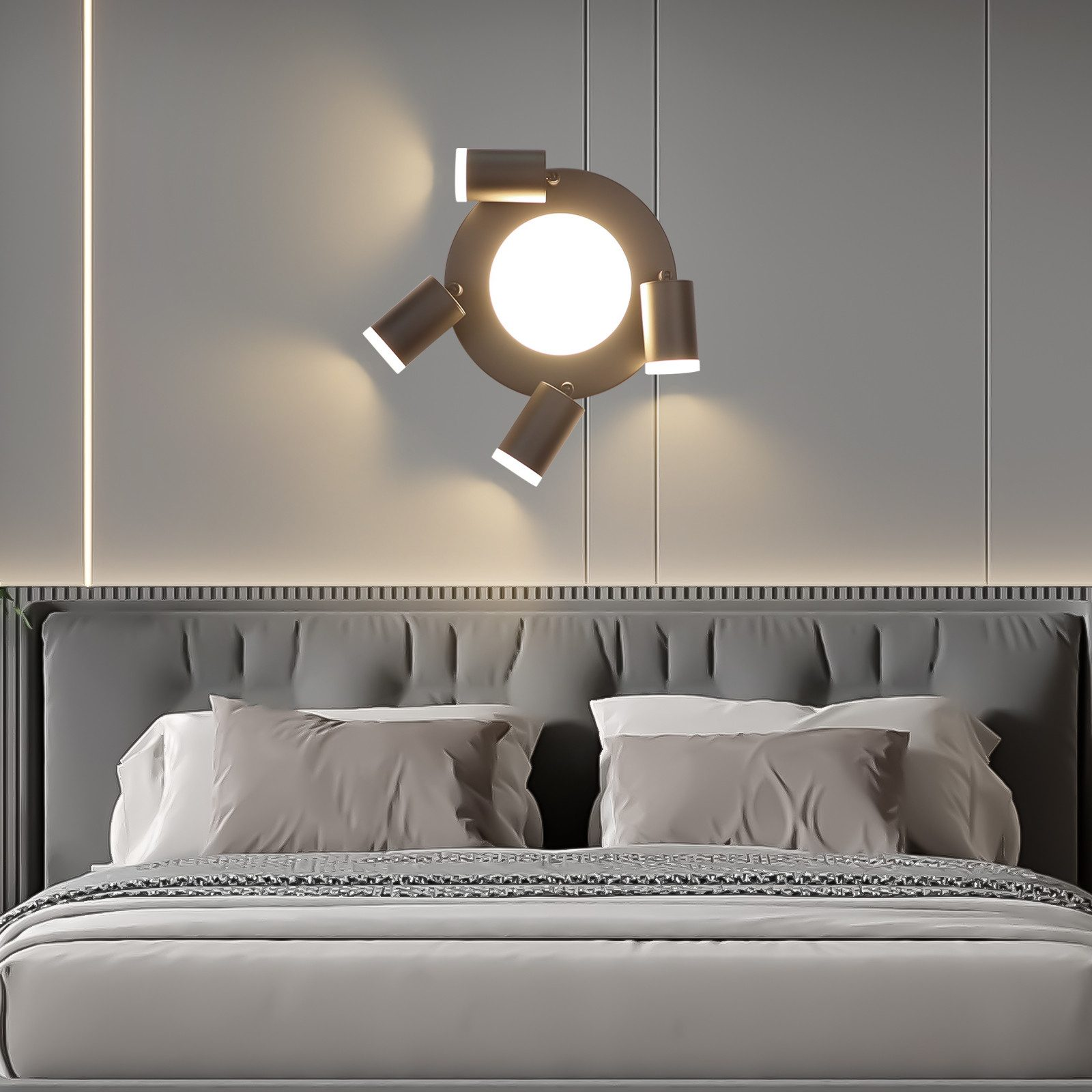Camera da letto moderna con lampada da parete sopra il letto. Il letto ha lenzuola e cuscini grigi.
