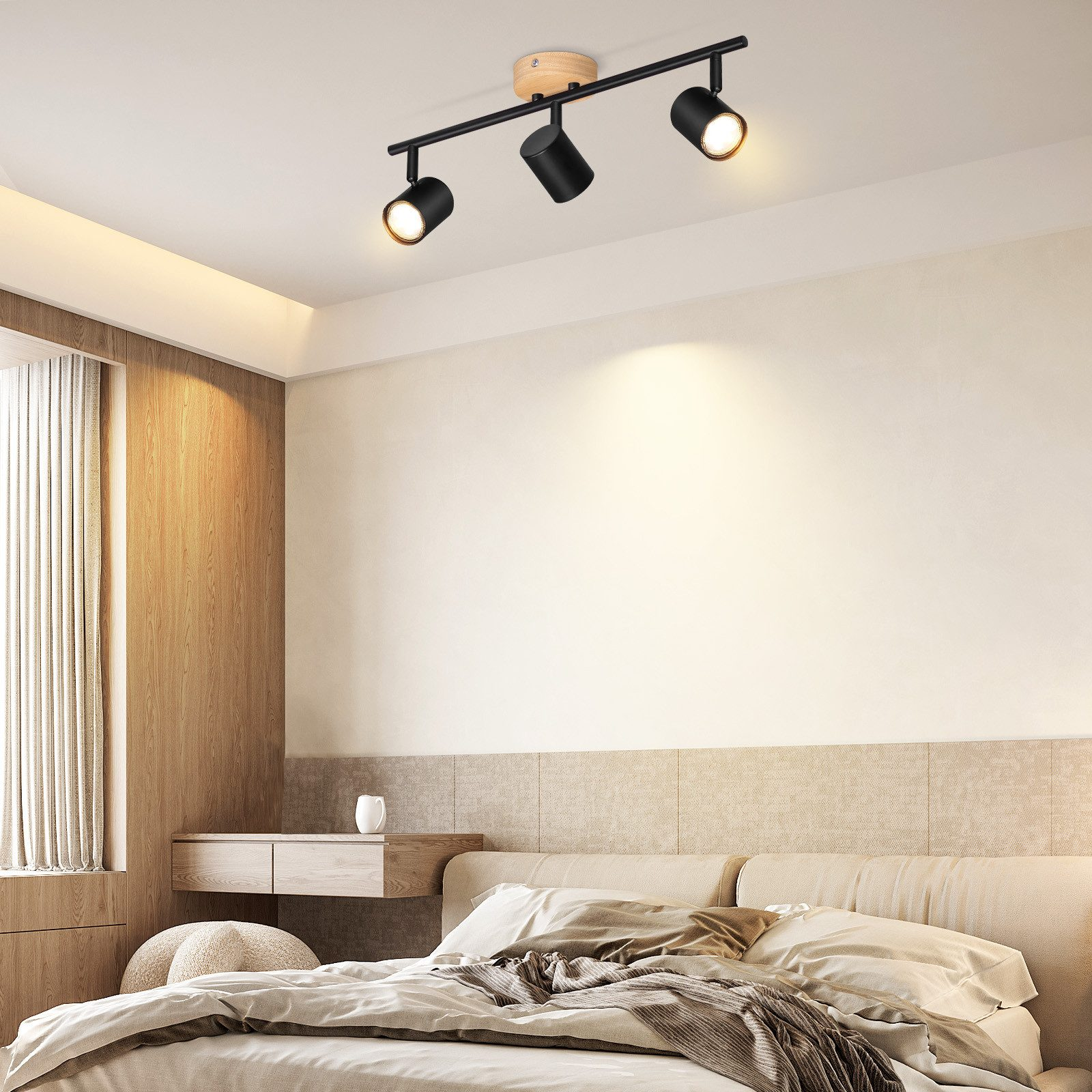 Scena sypialni. Czarne reflektory na drewnianej belce. Nowoczesny design.