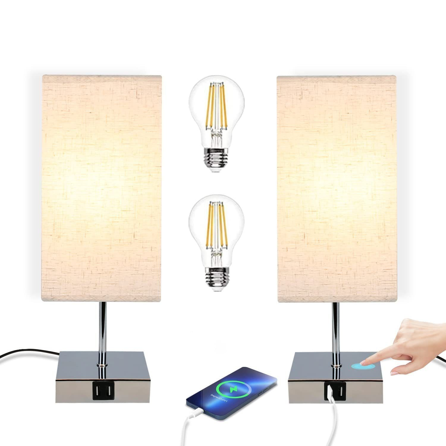 Dwie lampy z prostokątnymi abażurami. Dwie żarówki znajdują się pomiędzy lampami. Telefon się ładuje.