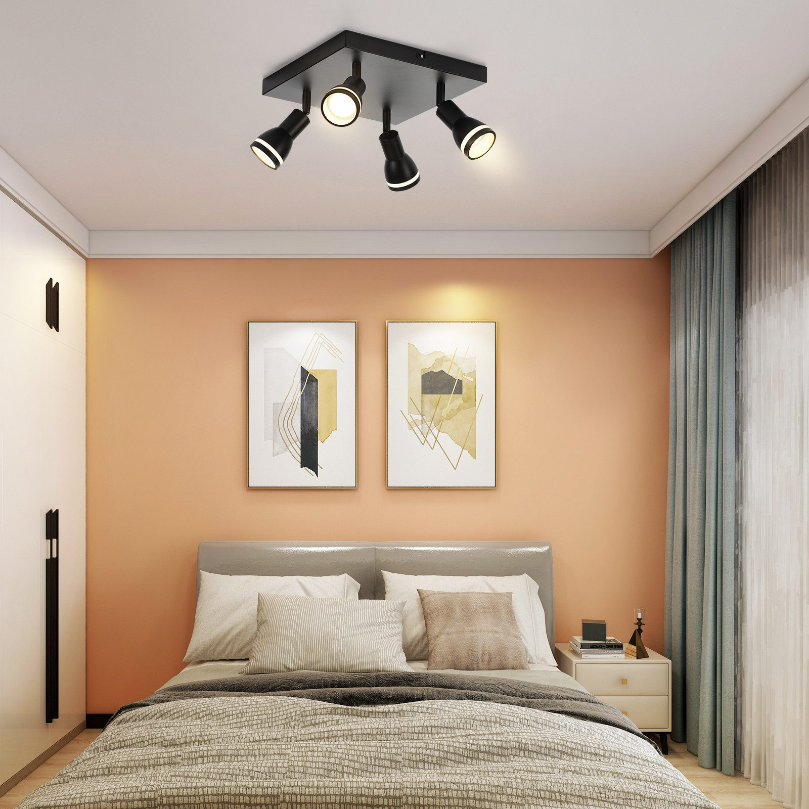 Camera da letto con letto, comodino e lampada da soffitto. L'apparecchio ha quattro faretti neri.
