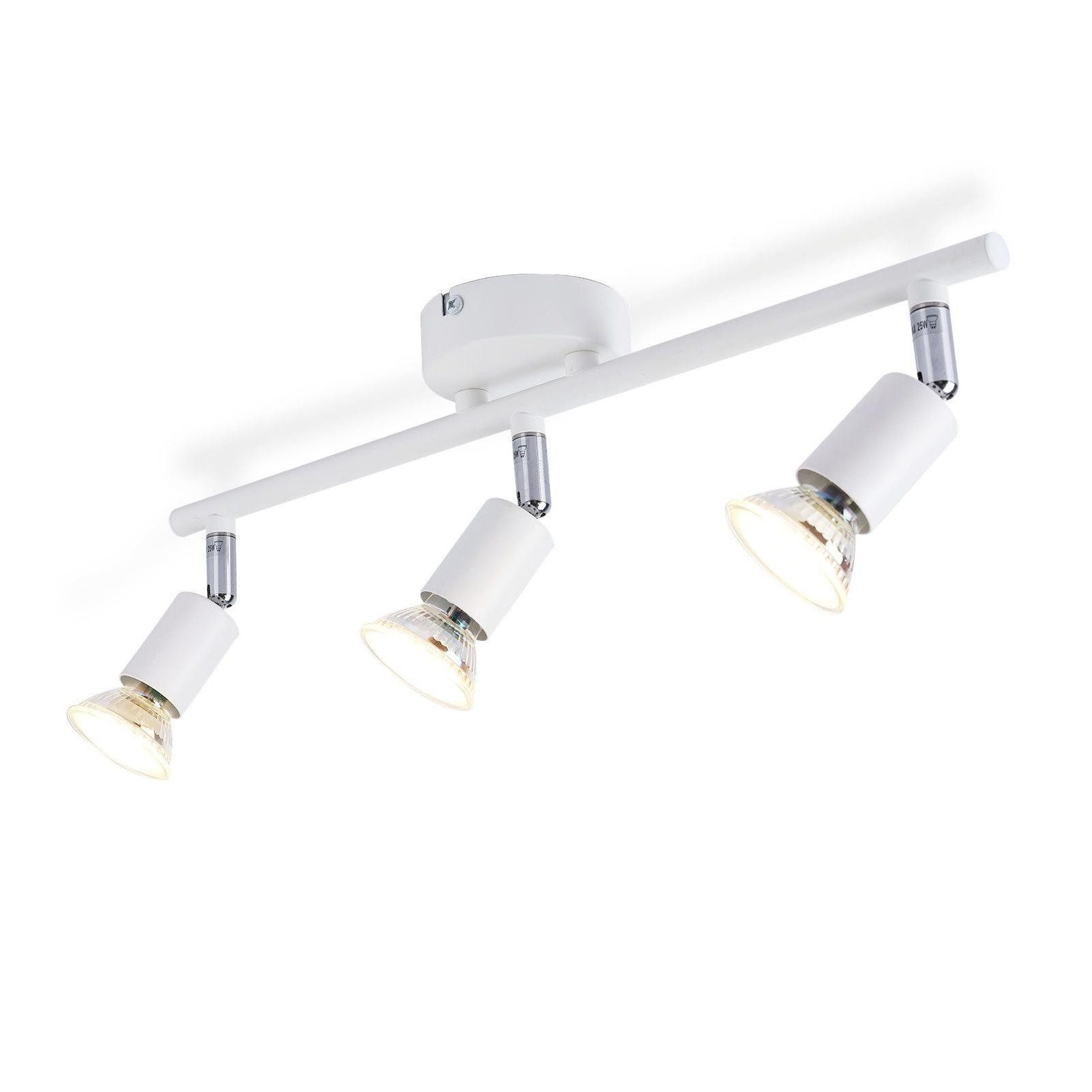 Apparecchio di illuminazione a binario bianco con tre faretti regolabili su sfondo bianco. Le lampadine sono accese.