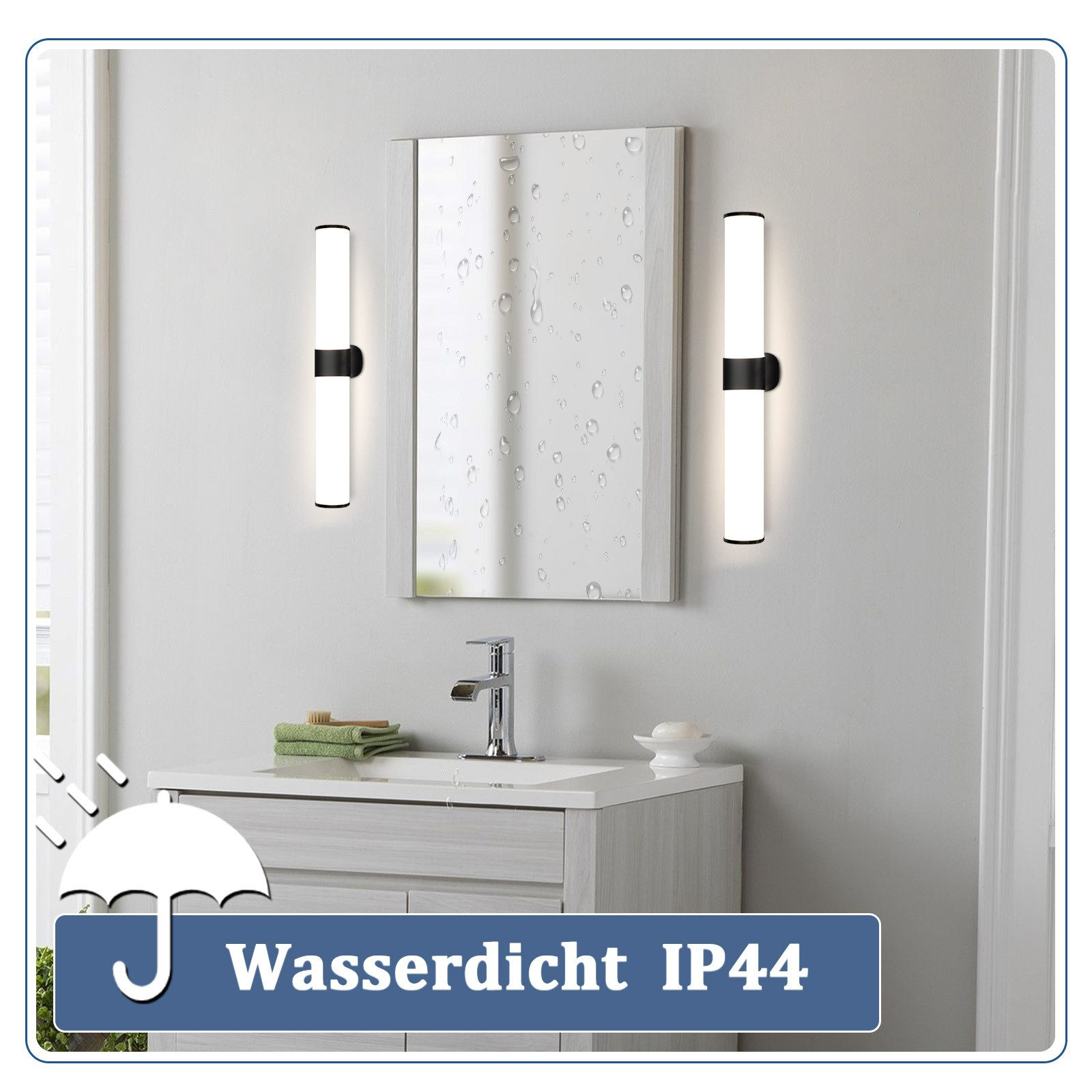 Configurazione del bagno con due luci a parete che affiancano uno specchio sopra un lavandino. Le luci sono bianche.