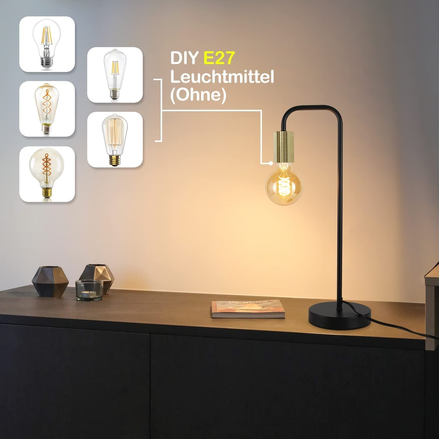 Una lampada nera con parte superiore dorata, lampadina Edison e tavolo in legno con altre lampadine.