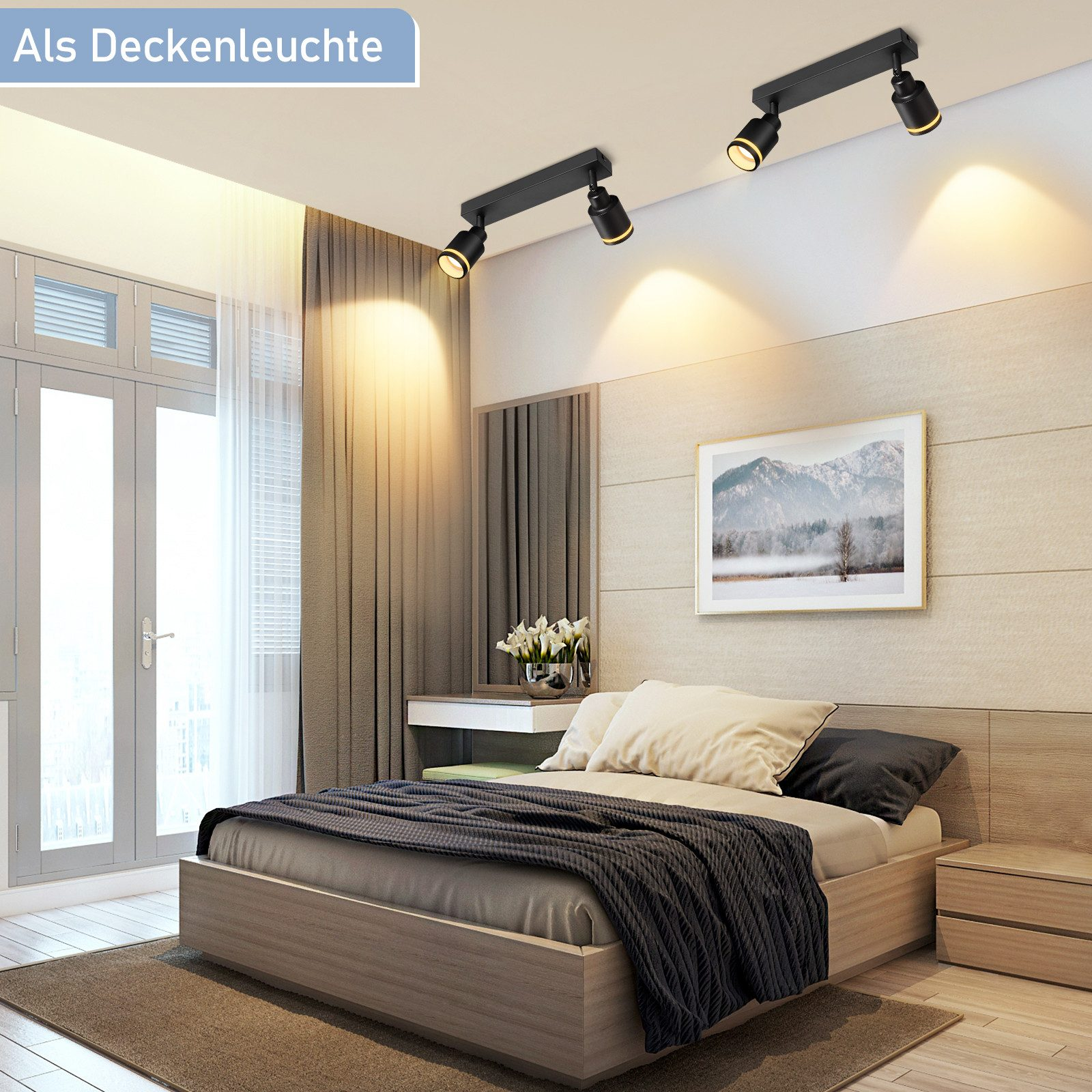Camera da letto con due faretti neri sul soffitto. Un letto, una finestra e un quadro sono visibili nella stanza.