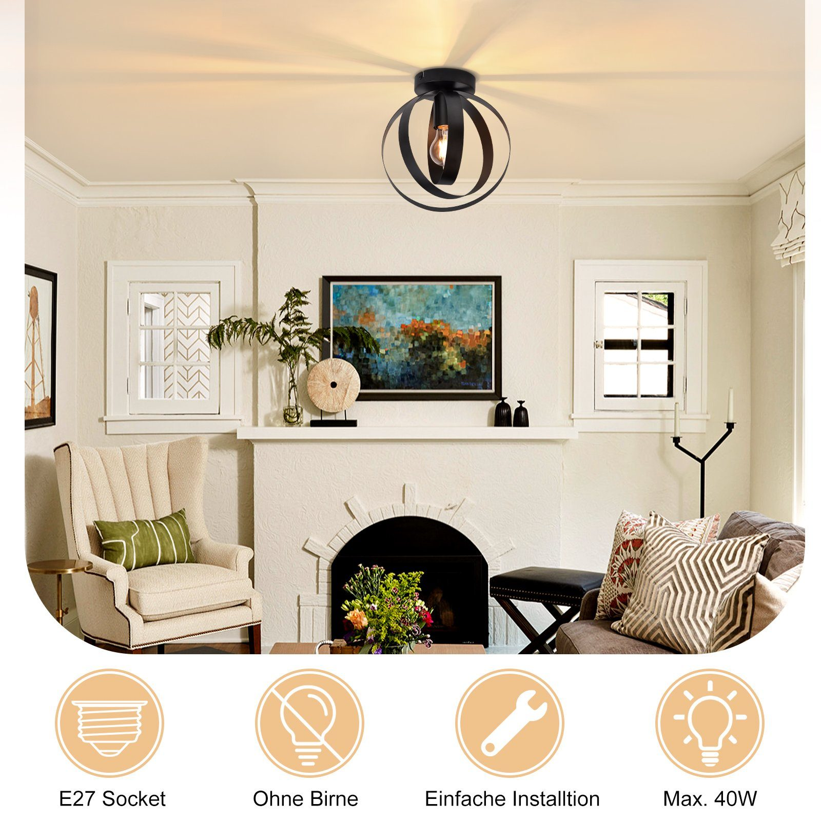 Un soggiorno con lampada da soffitto nera con lampadina, divano e altri mobili.