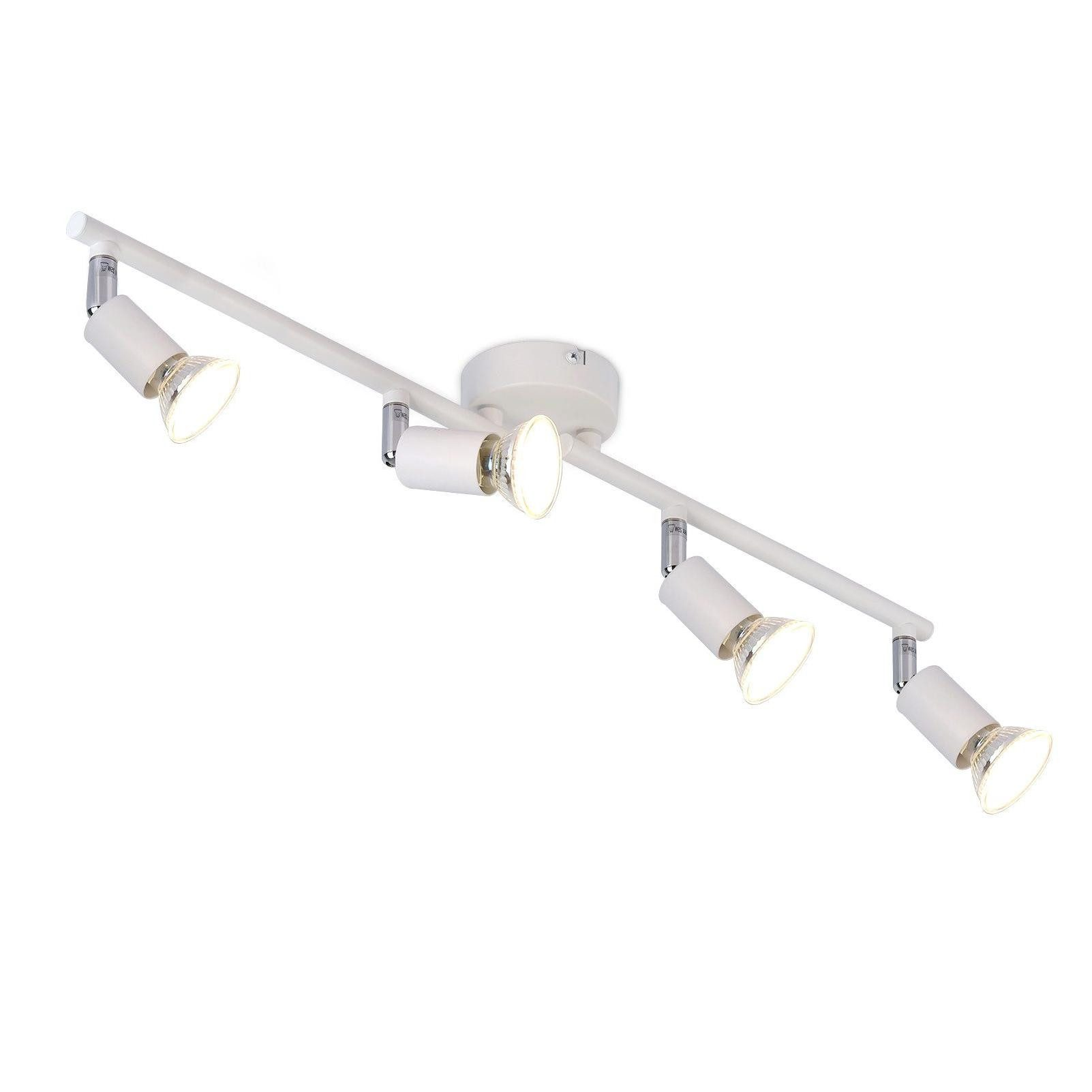 Illuminazione a binario bianca con quattro faretti. I faretti sono angolati.
