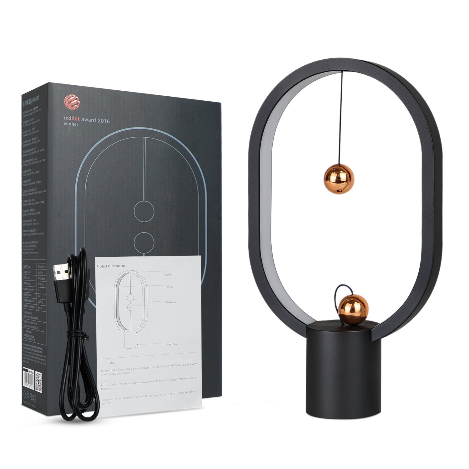 Czarna i złota lampa z dwiema kulami, pudełkiem i opisem produktu.