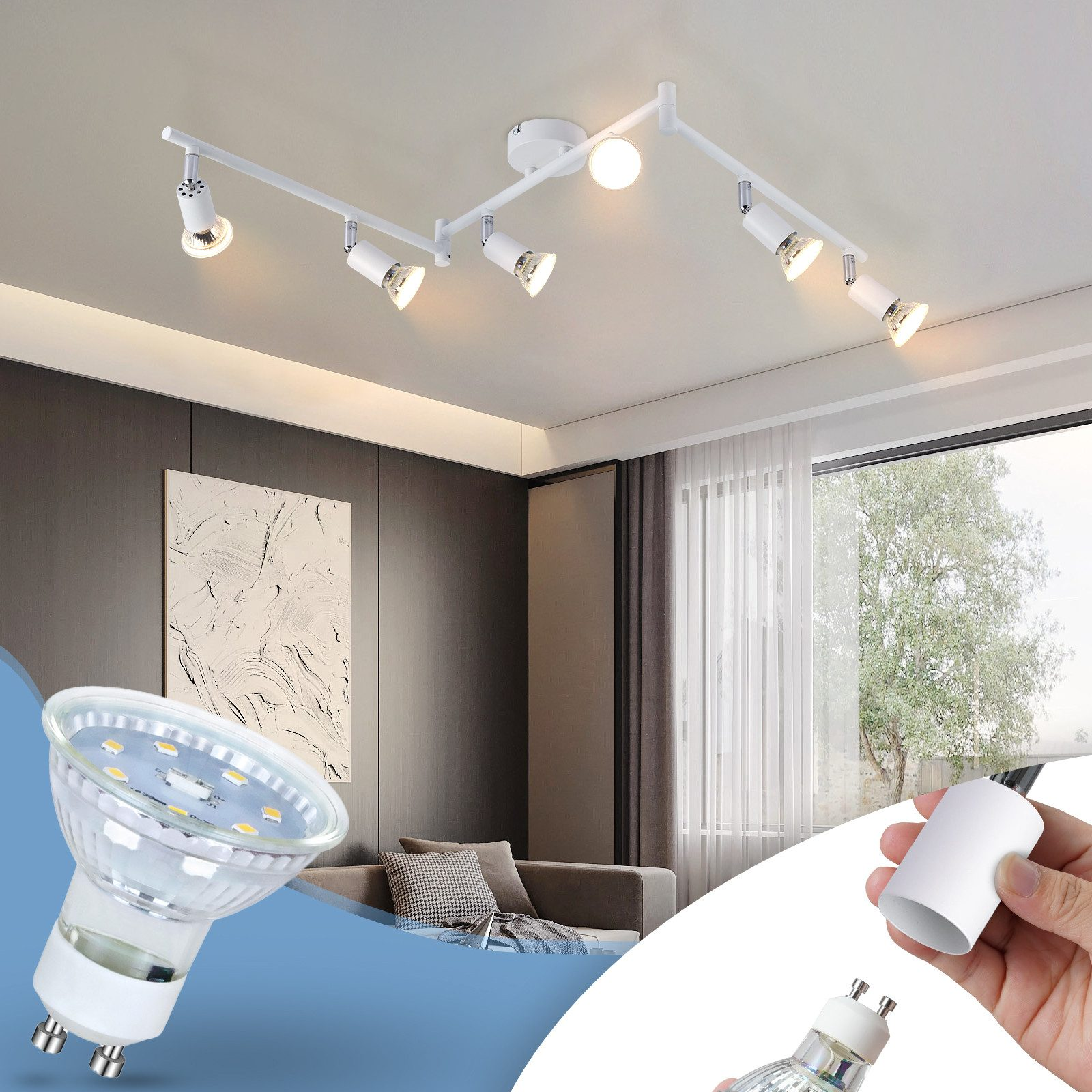 Un apparecchio di illuminazione a soffitto bianco con più faretti orientabili e un primo piano di una lampadina.