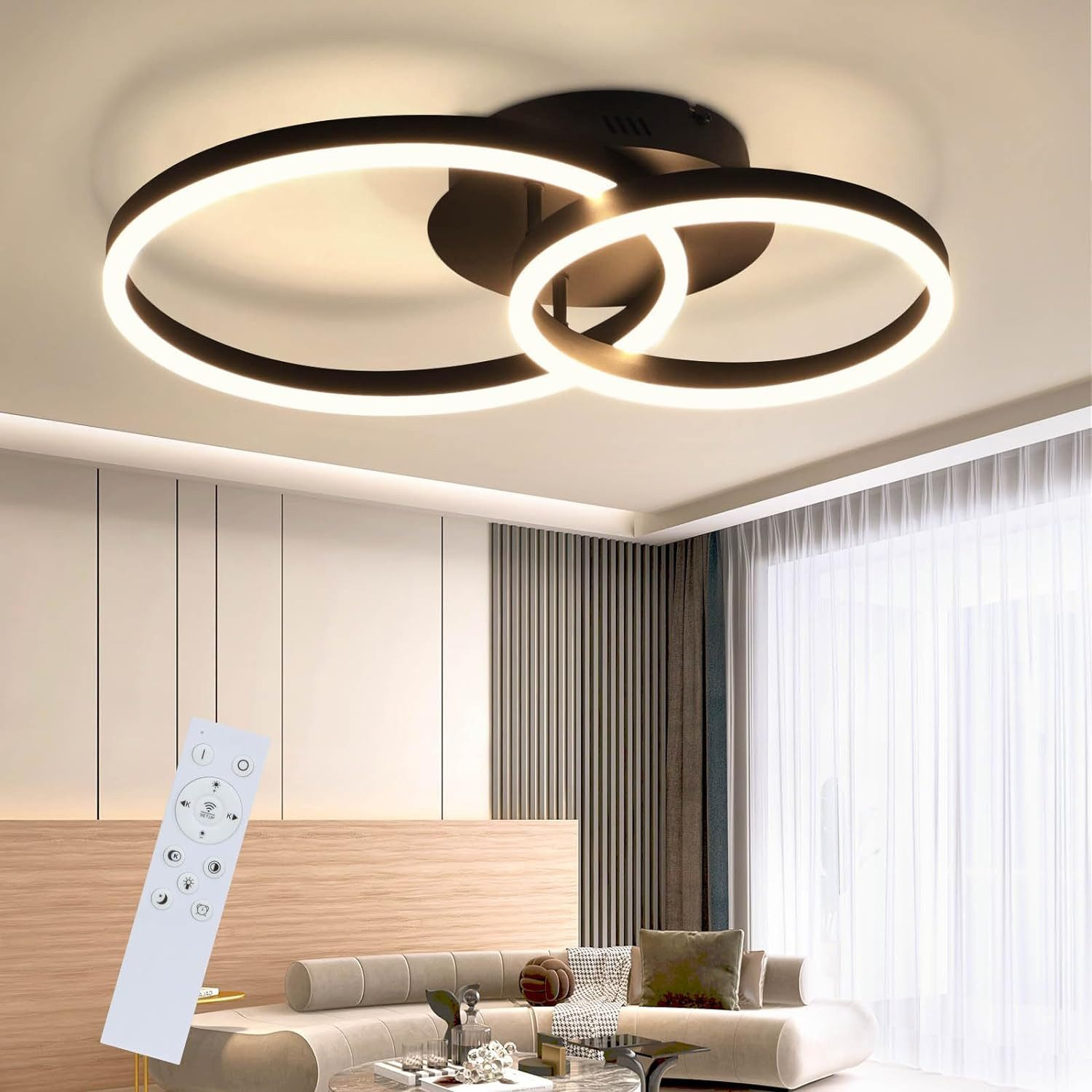 Lampada da soffitto con due anelli intersecanti, neri con luce interna bianca e telecomando.