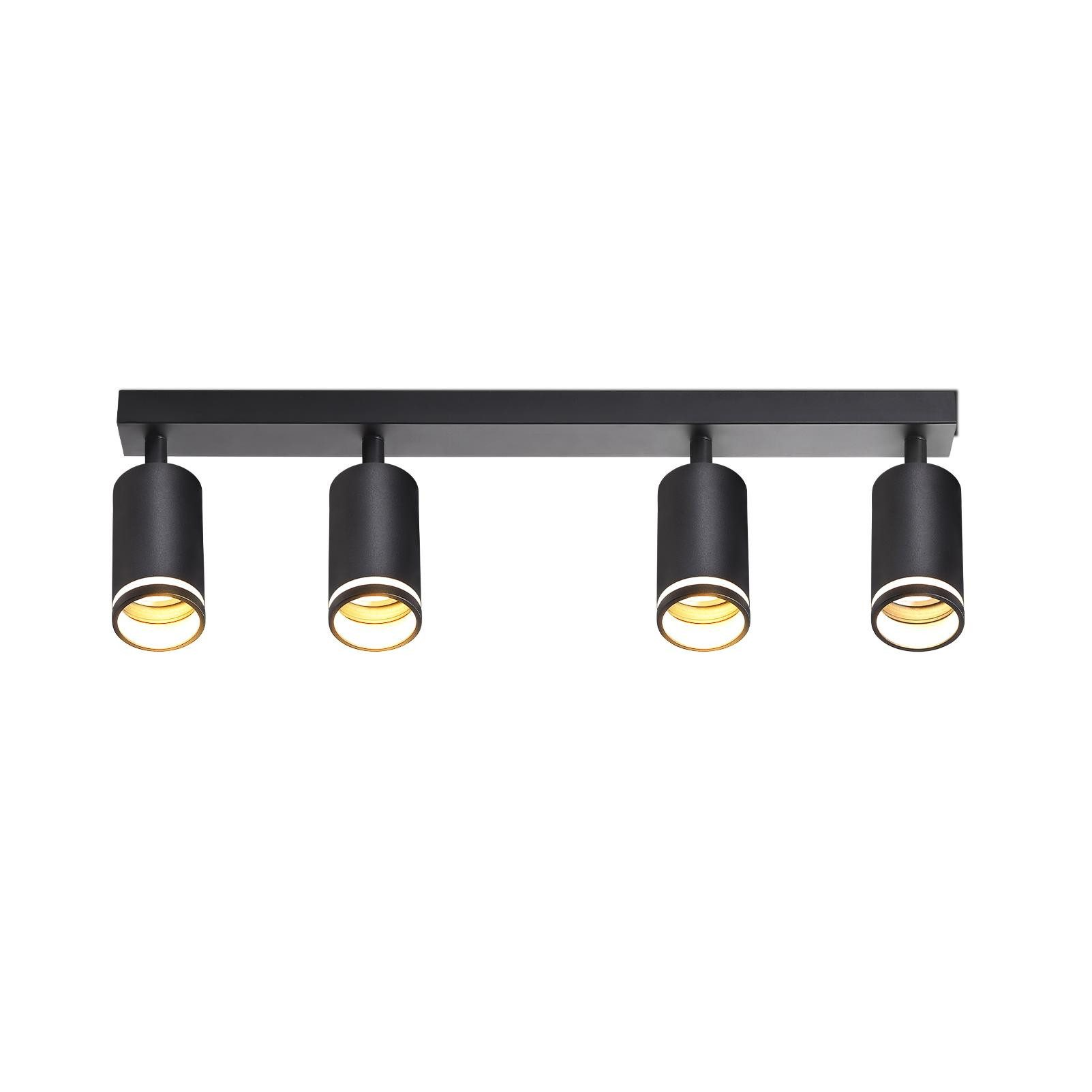 Un lampadario nero con quattro faretti orientabili. Le luci sono cilindriche.