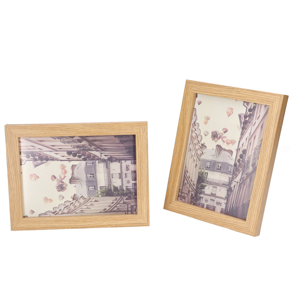 Zwei Holzbilderrahmen mit Stadtansichten und Ballons.