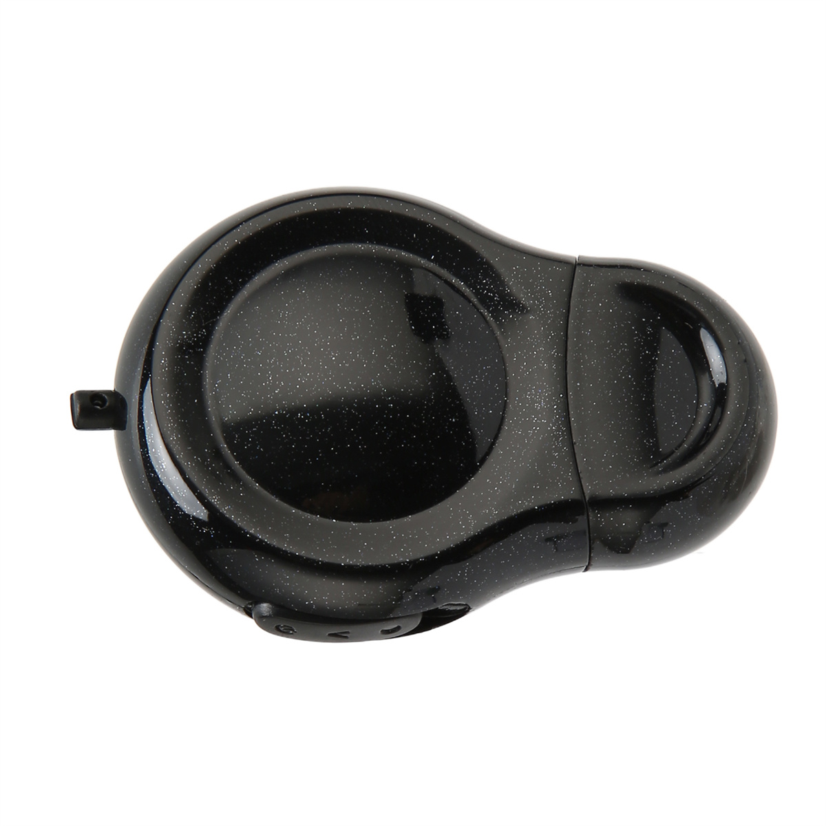 Ein schwarzes, rundes Objekt mit einem Loch in der Mitte. Es hat einen kleinen schwarzen Knopf.