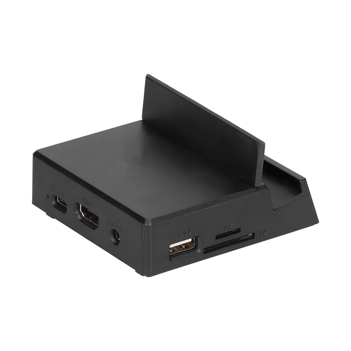 Ein schwarzes Gerät mit Anschlüssen und einem Steckplatz, mit einem schwarzen Ständer auf weißer Oberfläche.