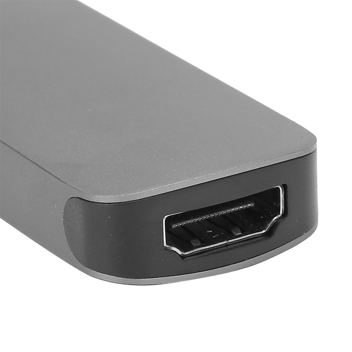 Graues Gerät mit HDMI-Anschluss, schräge Ansicht.