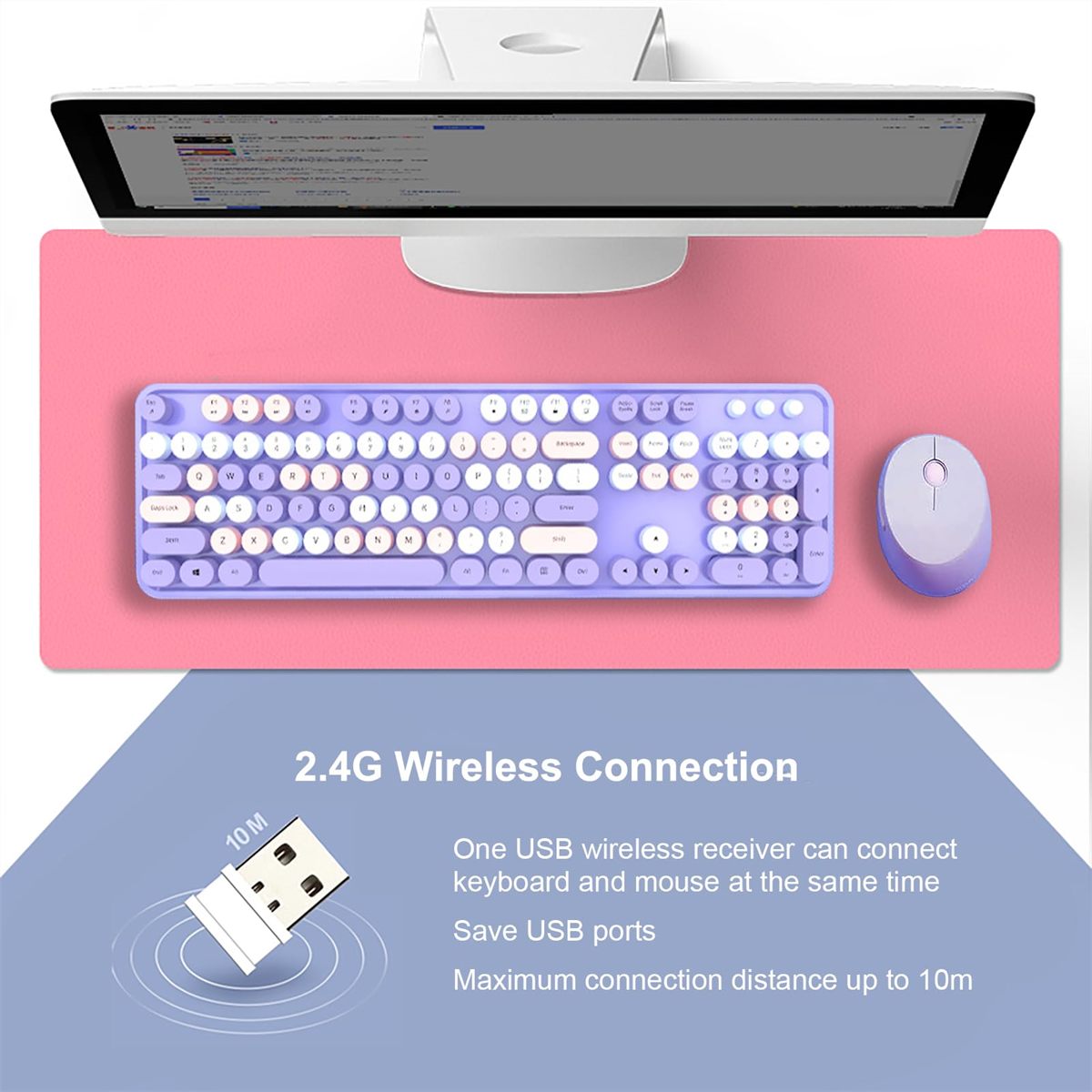 Eine lilafarbene Tastatur, Maus und ein pinkfarbenes Mauspad unter einem Computermonitor.