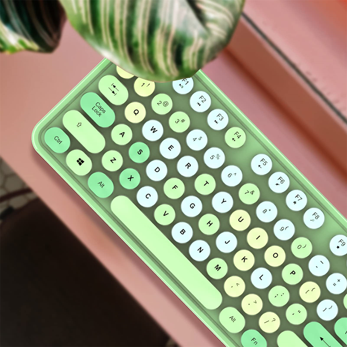 Eine hellgrüne Tastatur mit abgerundeten Tasten und Draufsicht.
