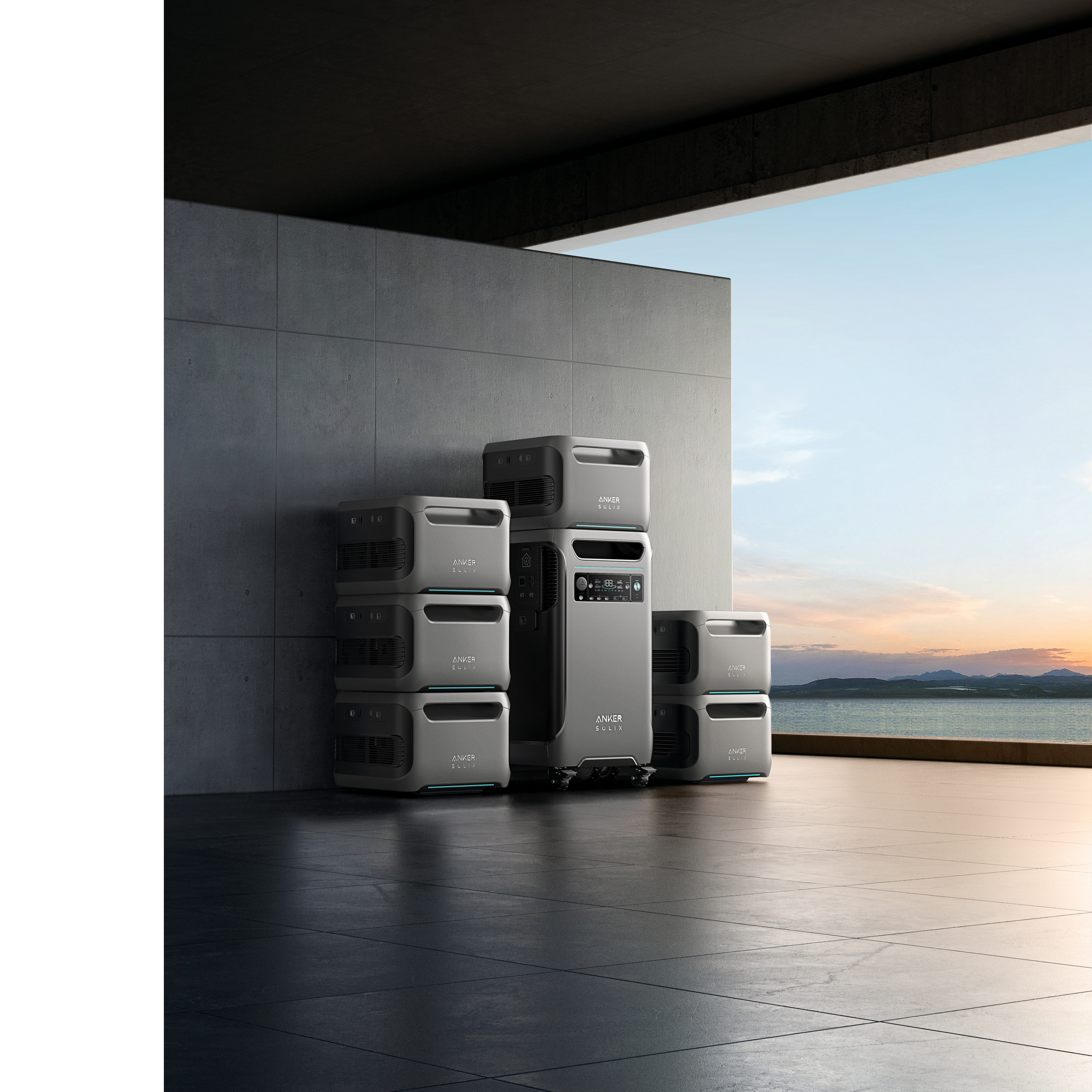 Stos szarych elektrowni z większą, w pobliżu jeziora i widoku zachodu słońca.