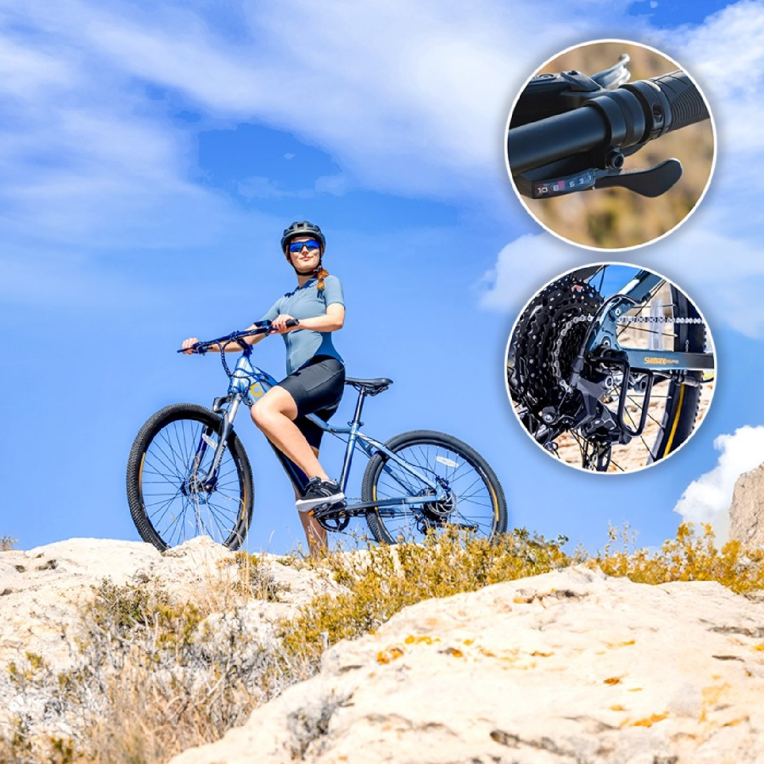 Donna in bicicletta su terreno roccioso sotto un cielo blu. Sono visibili primi piani dei componenti della bici.