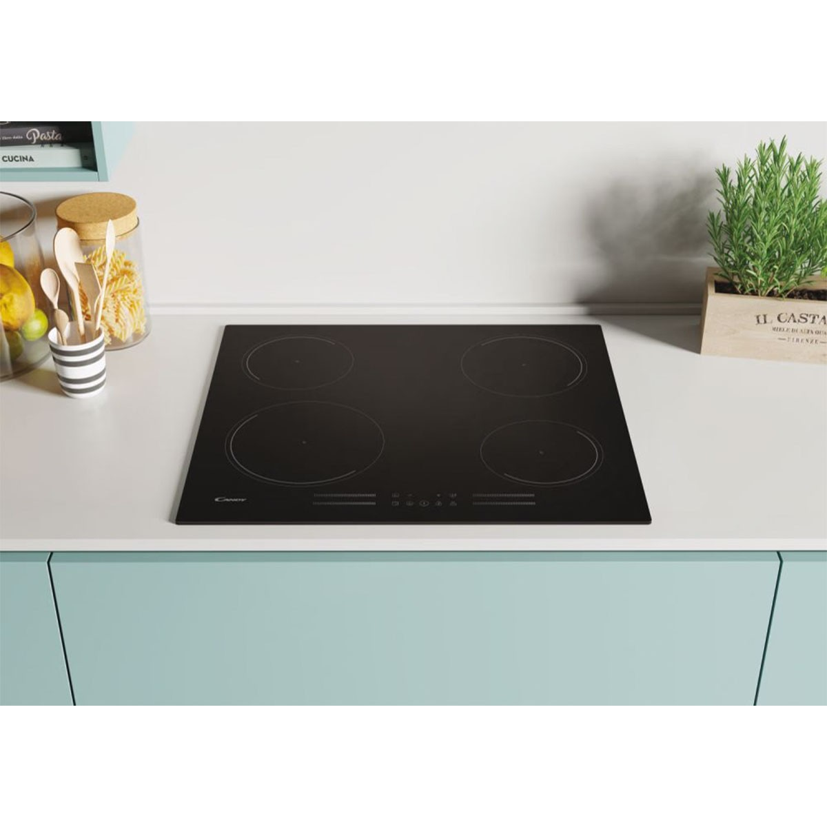 Czarna płyta indukcyjna z czterema okrągłymi strefami gotowania. Na jasnoniebieskim i białym blacie.
