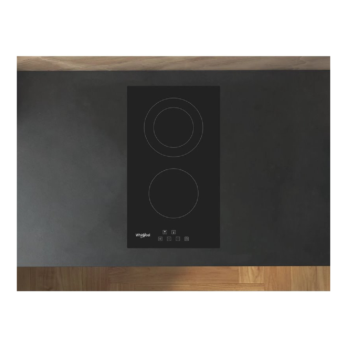 Una placa de inducción negra con dos zonas de cocción circulares. La marca es Whirlpool.