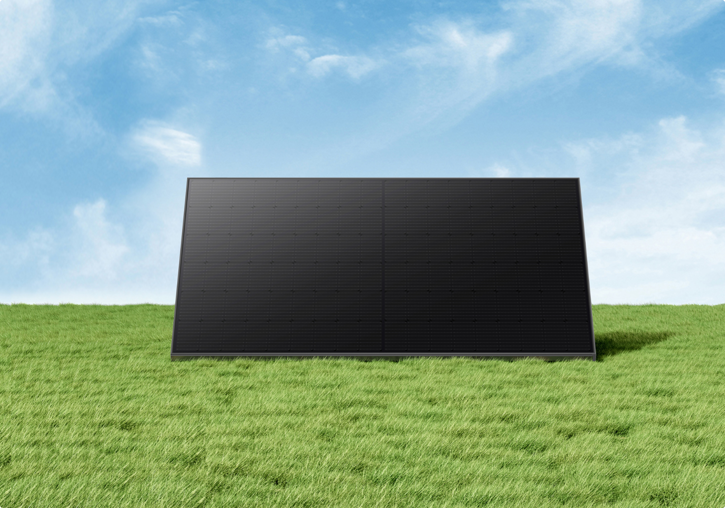 Un grande pannello solare su un campo erboso sotto un cielo blu con nuvole.