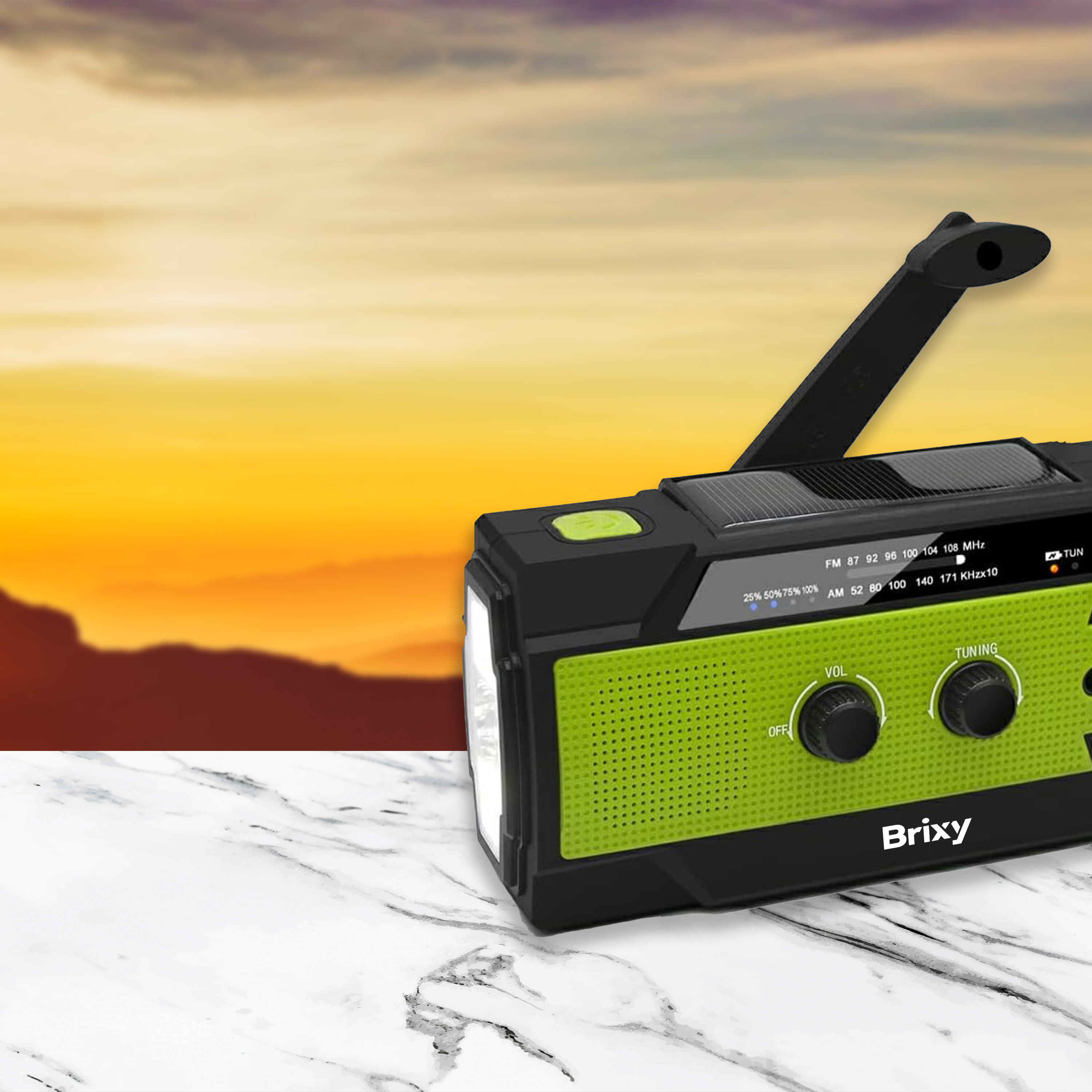 Black and green radio with a crank, light, and dial. Sunset background.