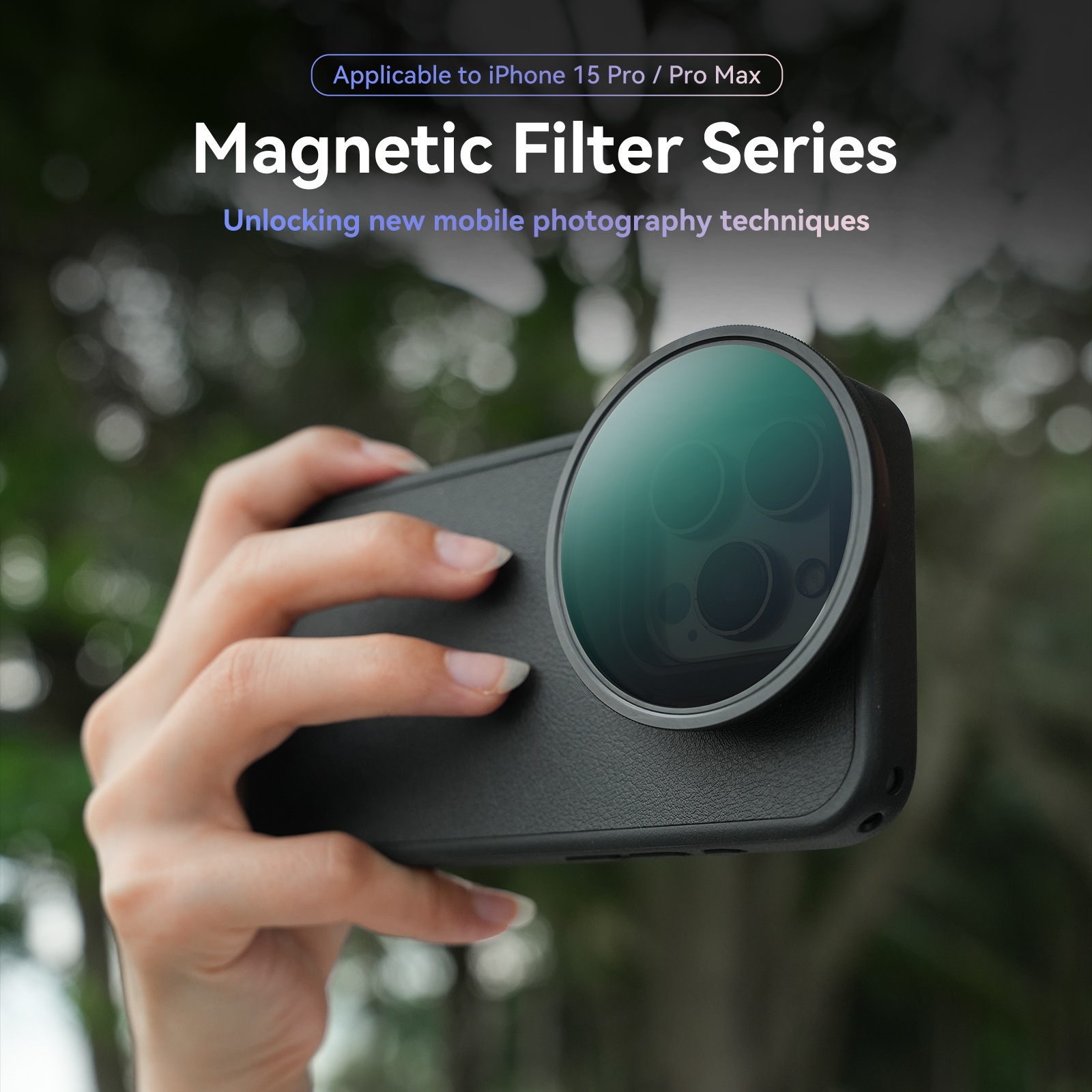 Hand holding a phone with a magnetic lens attached. Blurred green background, product shot.