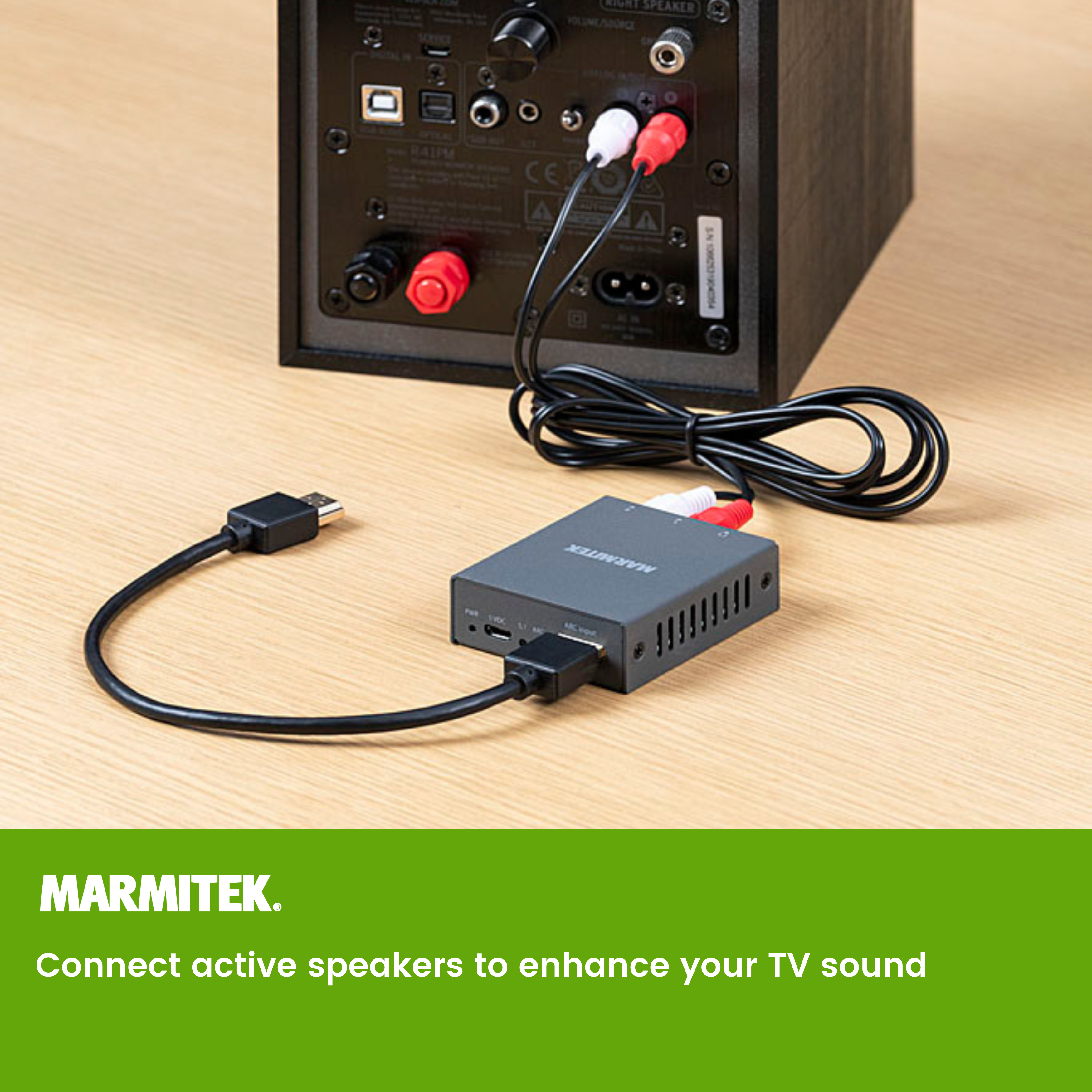 Black device with cables connected to a speaker and a black box.
