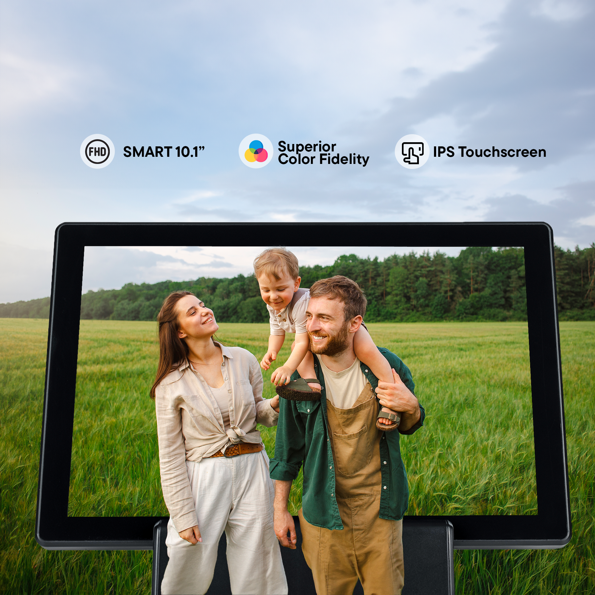 Family with a child on a tablet screen, in front of a field and sky.  