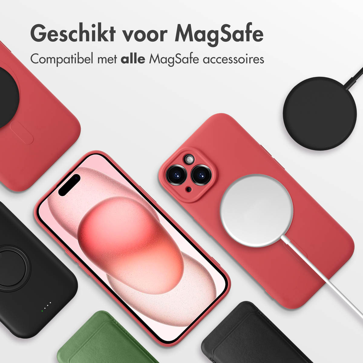 Multiple phones and cases. Cases in black, green, and red, with a charging pad. Phones are in pink and red.