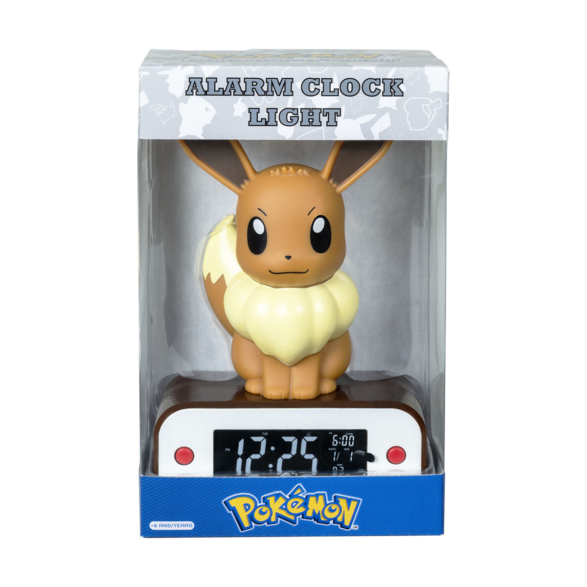 Budzik Eevee Pokémon w pudełku. Brązowa figurka Eevee z żółtym kołnierzem. Niebieskie pudełko.