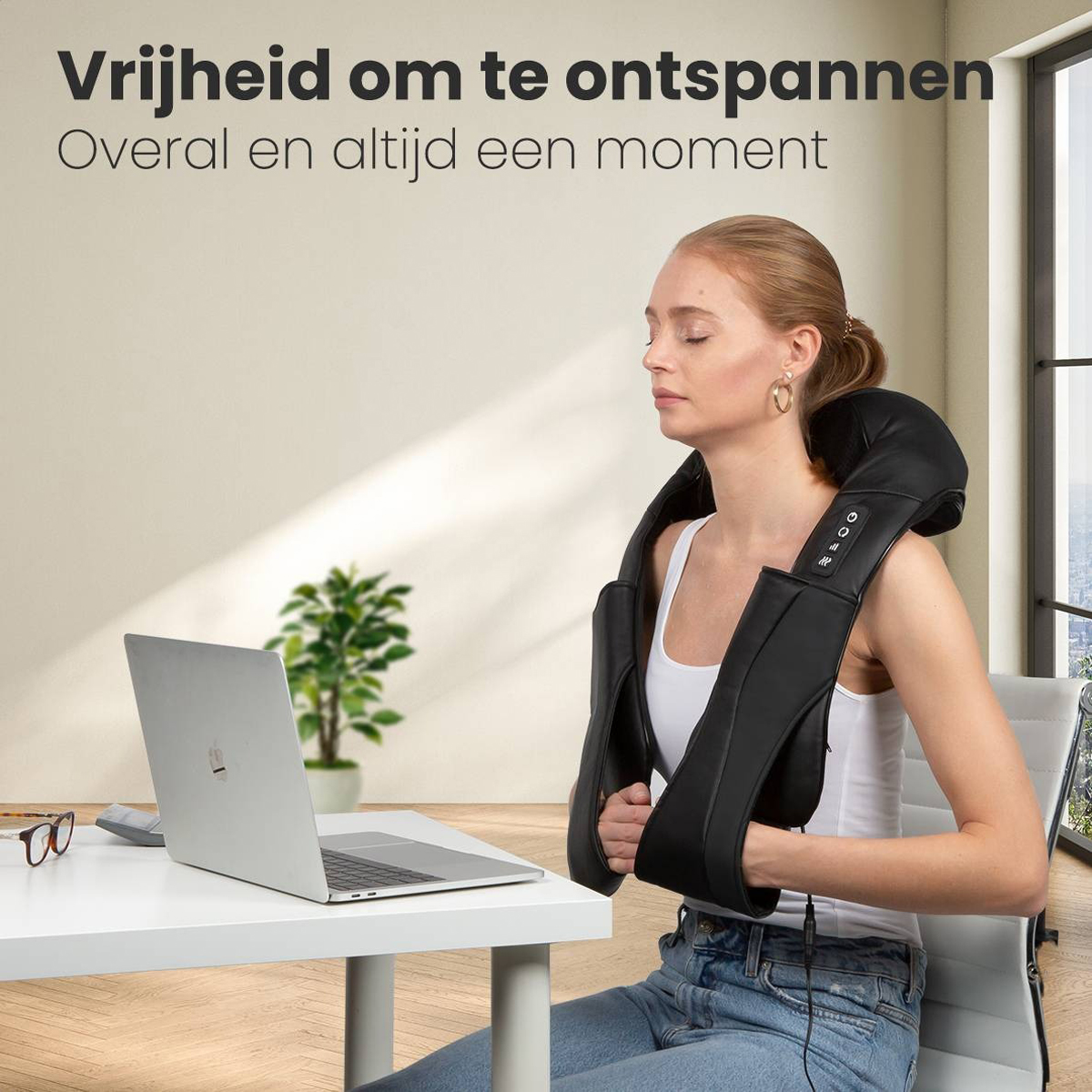 Woman using a neck massager at a desk with a laptop.