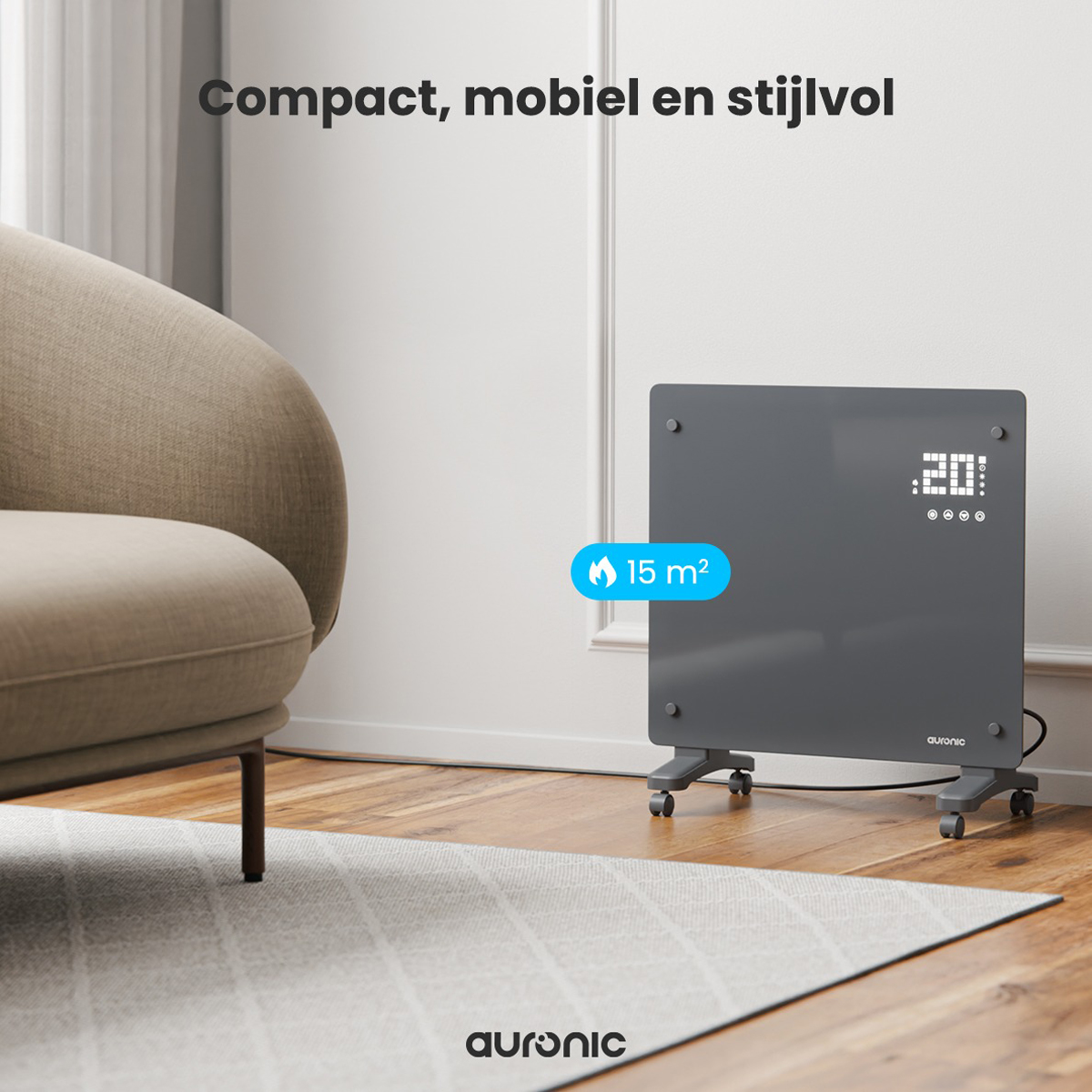 Un radiateur gris est posé sur un sol en bois. Il a des roues et se trouve devant un mur. Un tapis et une chaise sont montrés.