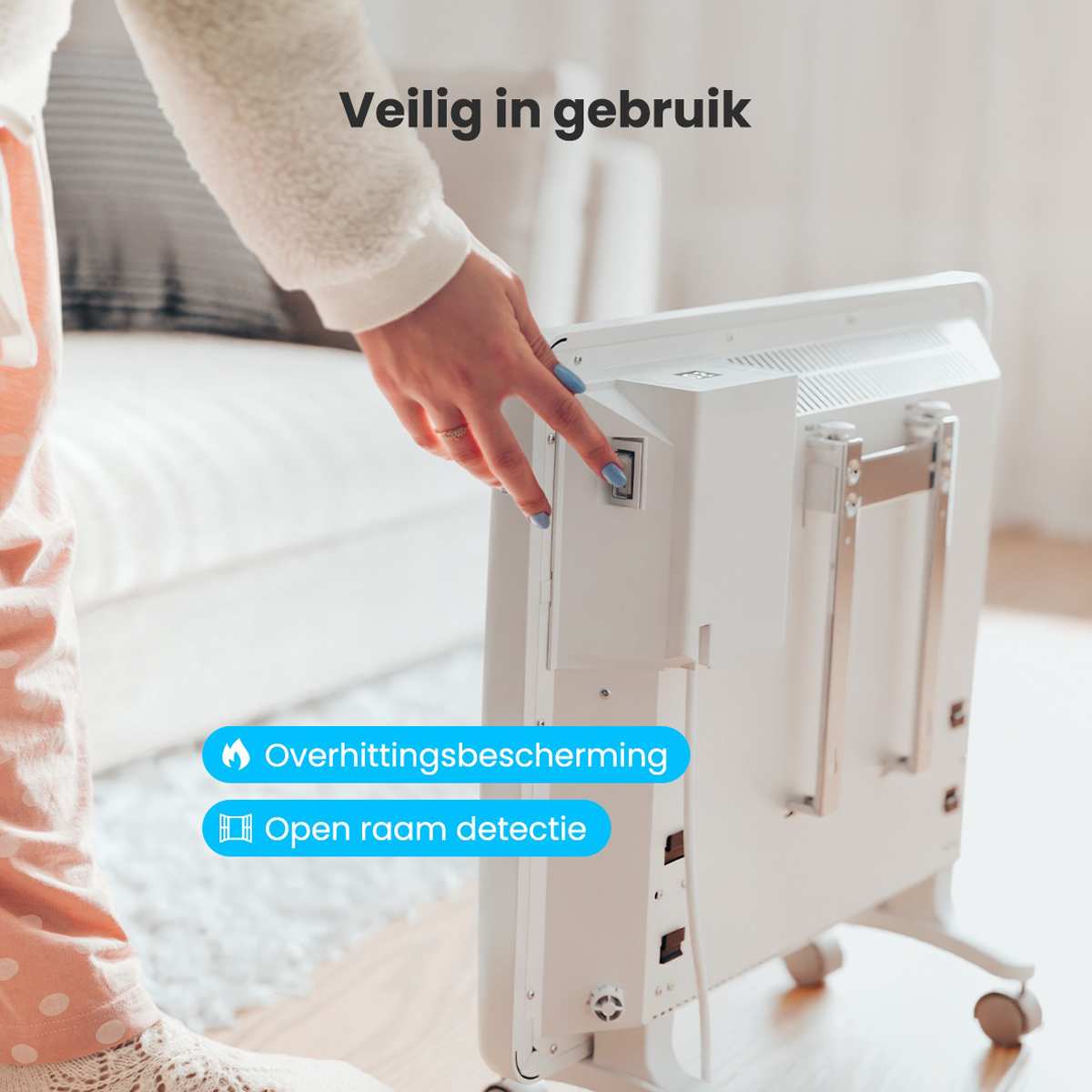 Une femme allume un radiateur blanc. Il dispose d'une protection contre la surchauffe et d'une détection d'ouverture de fenêtre.